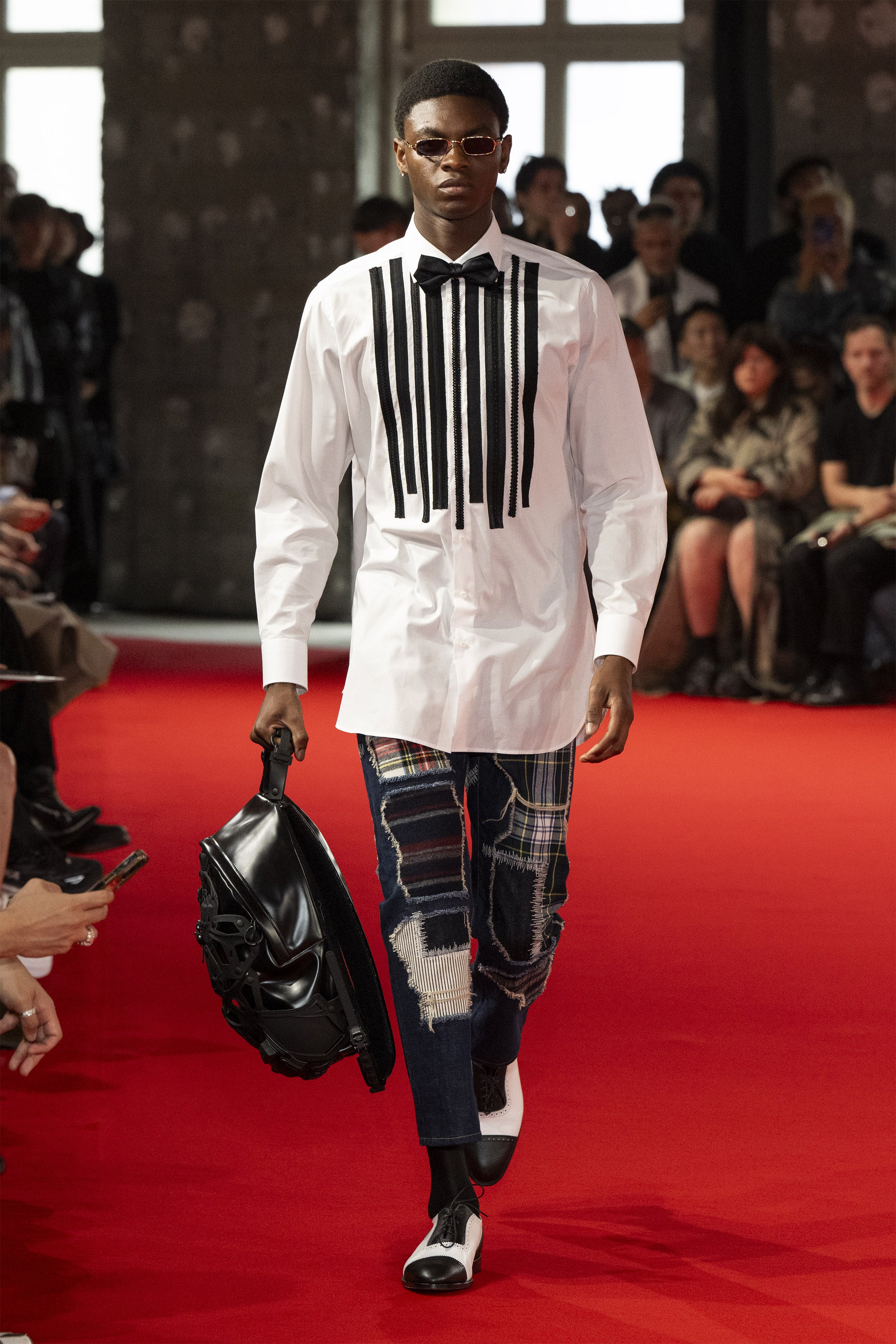 Fashion model wearing a JUNYA WATANABE MAN SS25 outfit