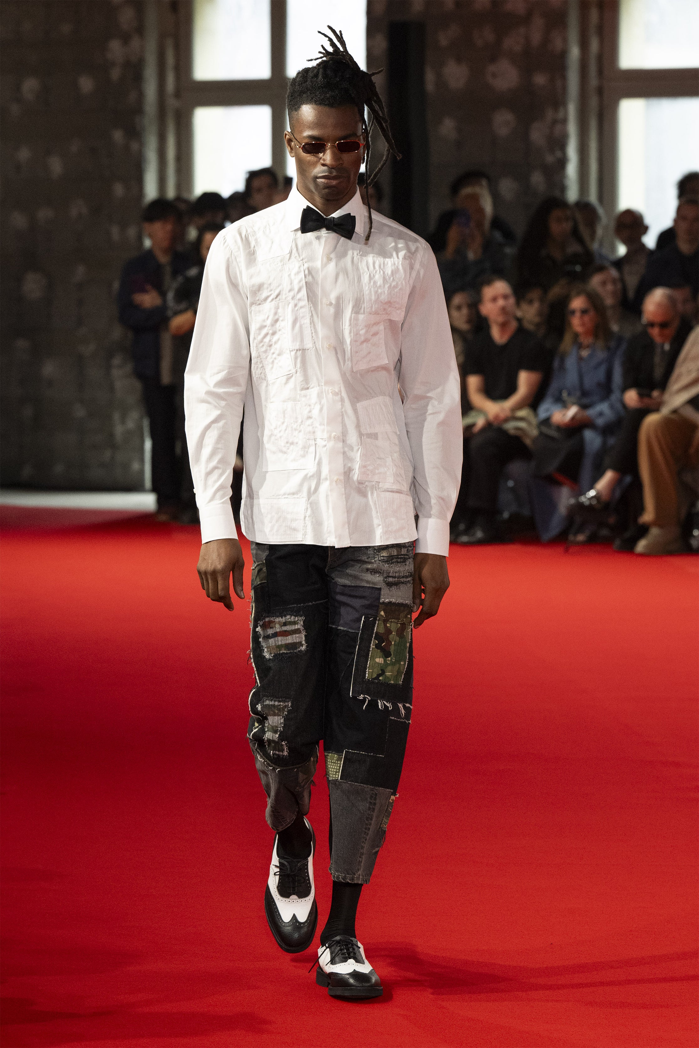 Fashion model wearing a JUNYA WATANABE MAN SS25 outfit