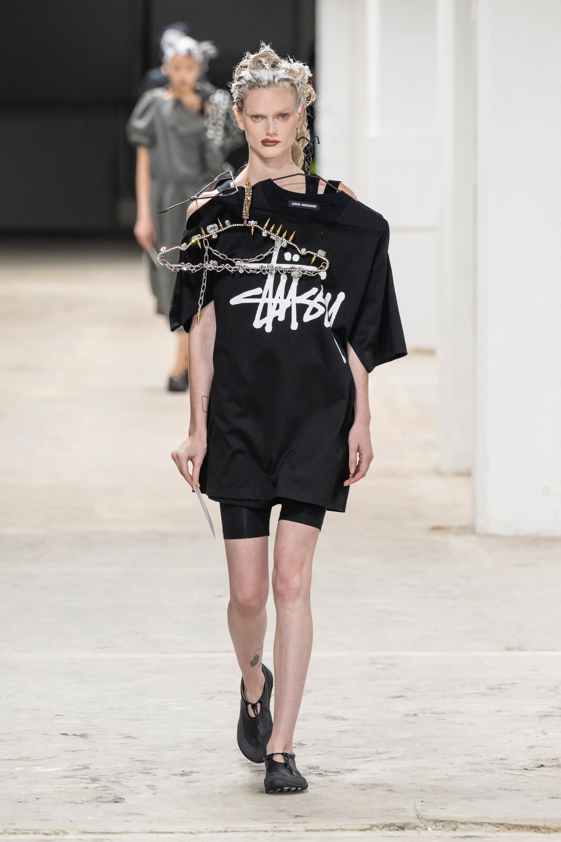 Fashion model wearing a Junya Watanabe SS26 outfit