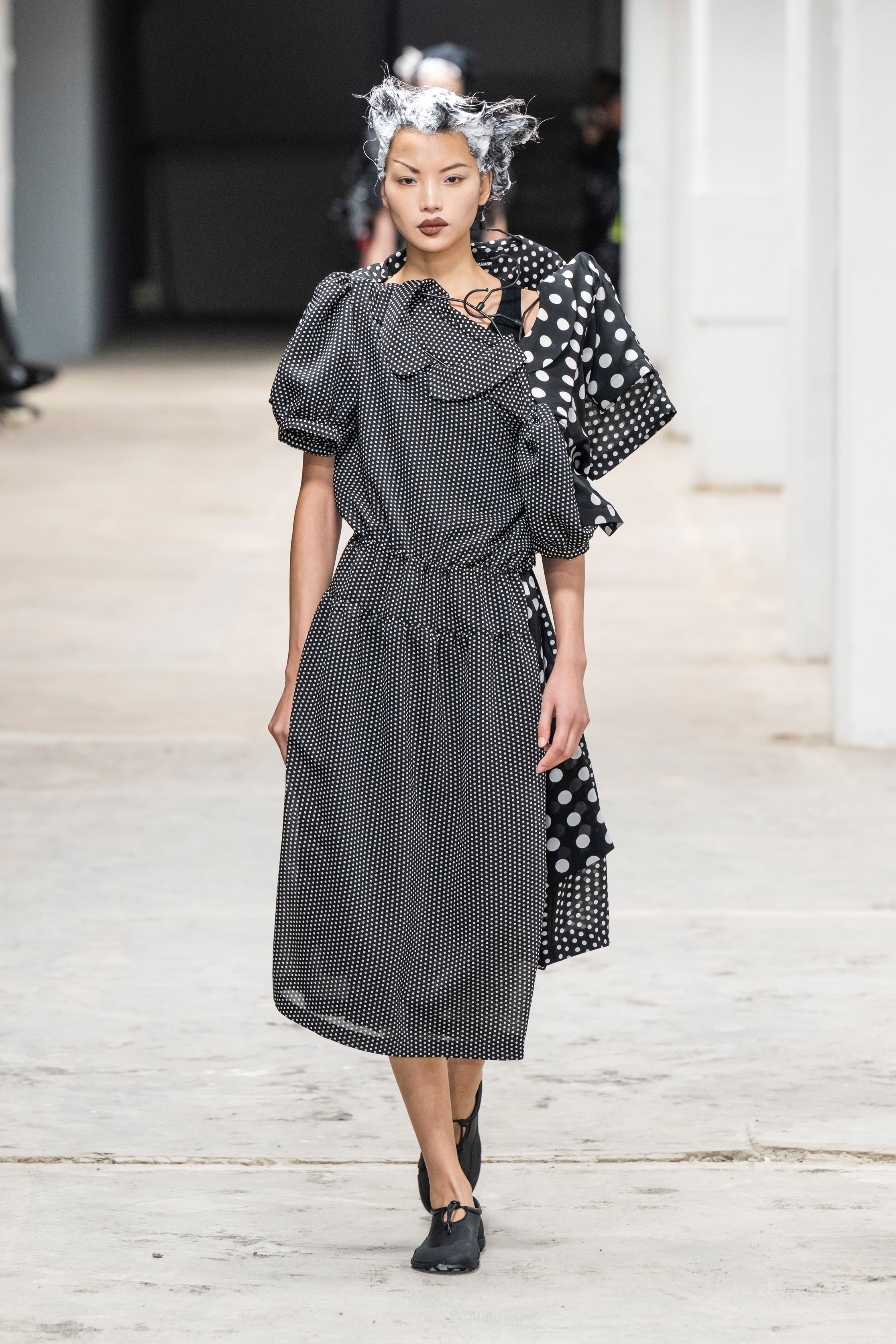 Fashion model wearing a Junya Watanabe SS26 outfit