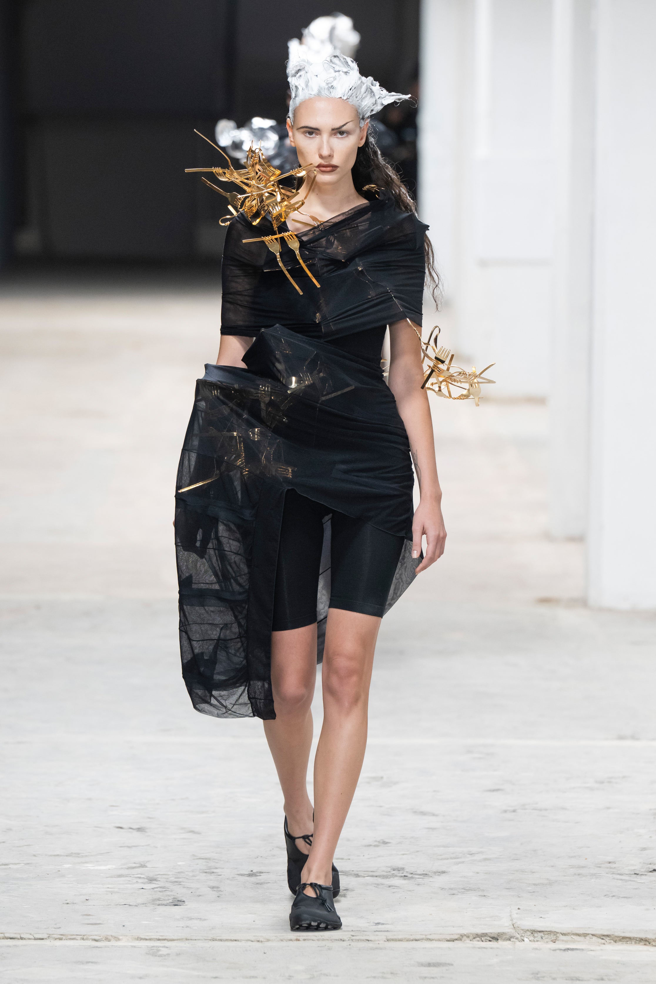 Fashion model wearing a Junya Watanabe SS26 outfit