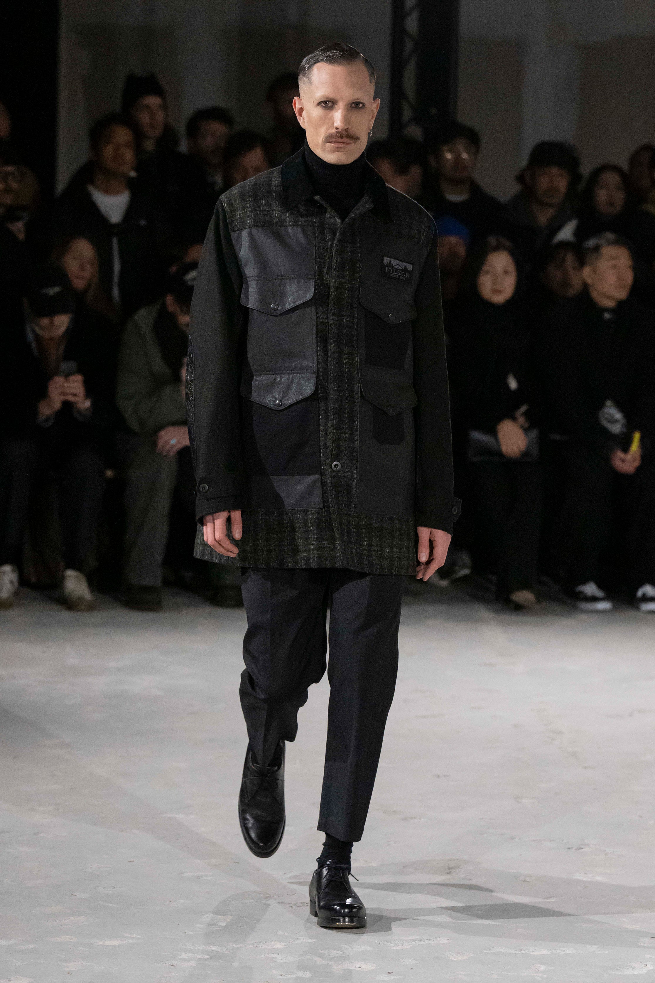Fashion model wearing a Junya Watanabe Man AW25 outfit