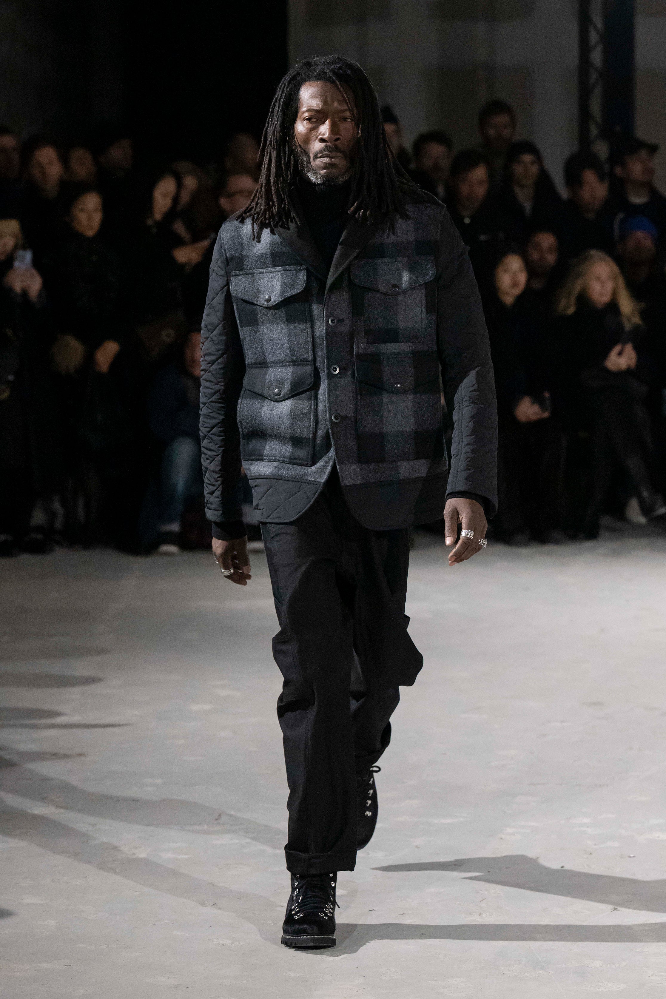 Fashion model wearing a Junya Watanabe Man AW25 outfit