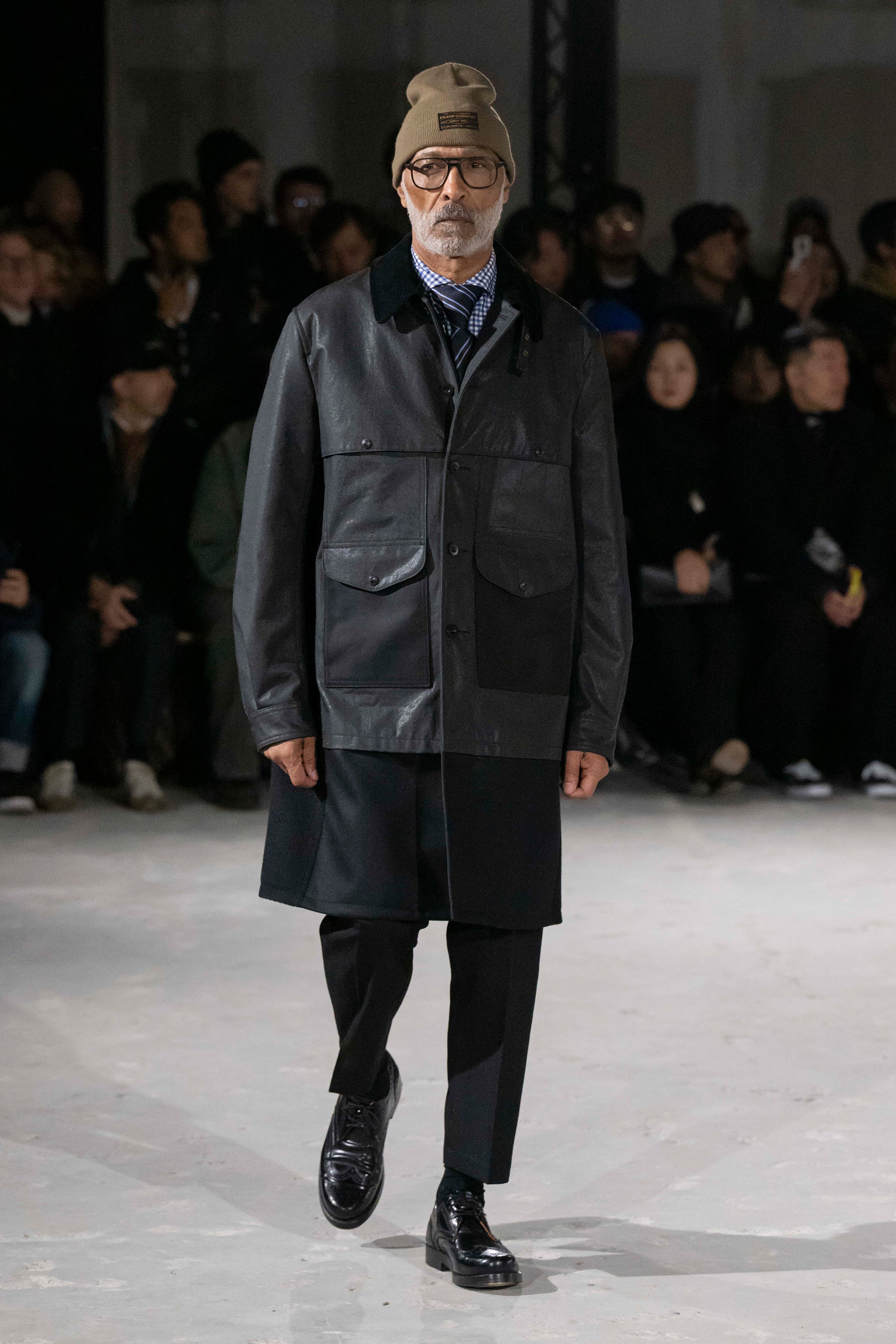 Fashion model wearing a Junya Watanabe Man AW25 outfit