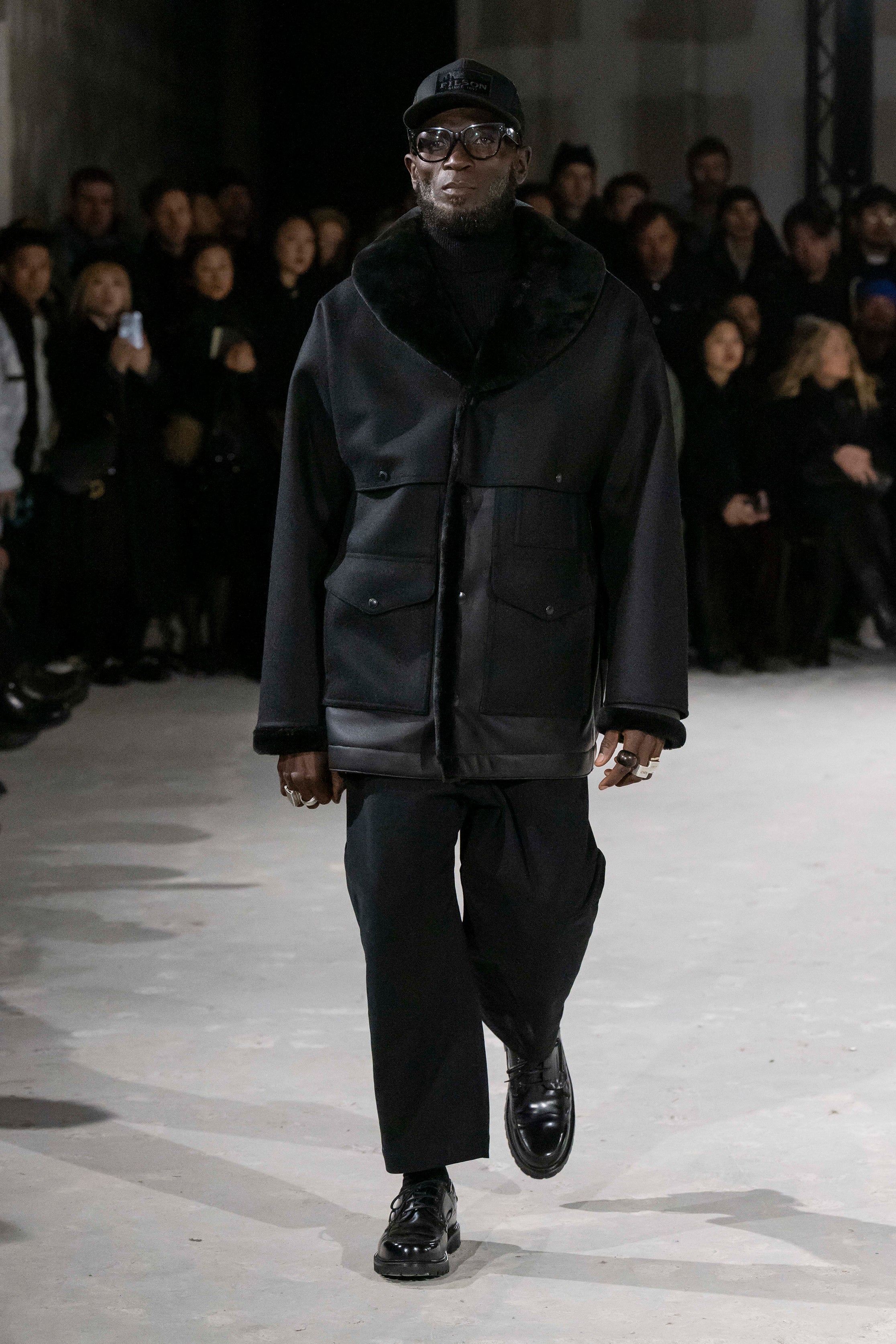 Fashion model wearing a Junya Watanabe Man AW25 outfit
