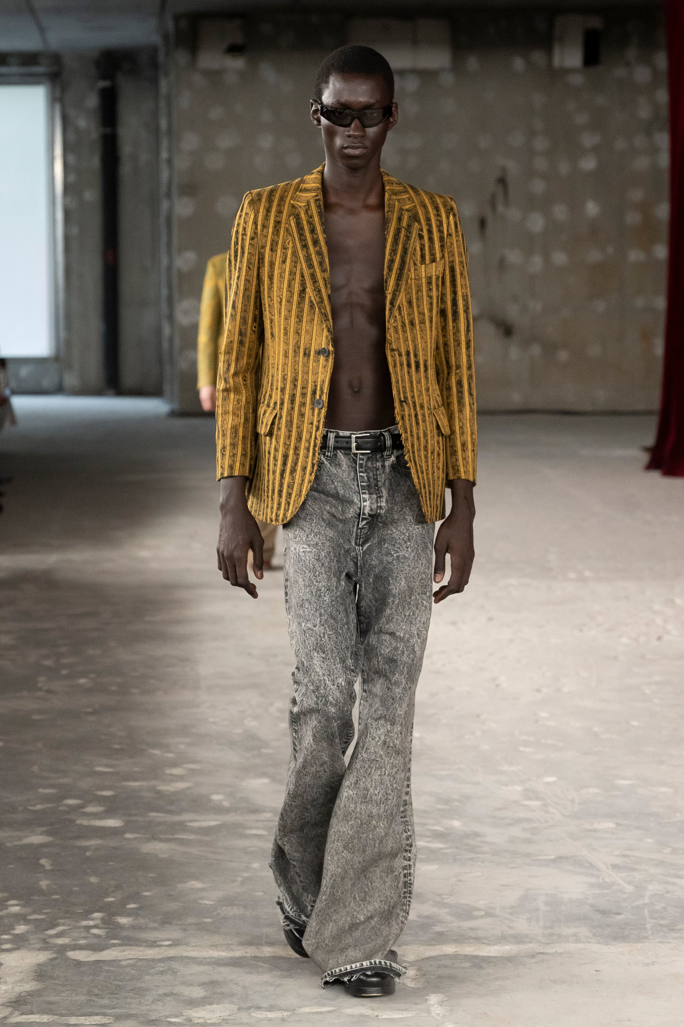 Fashion model wearing a Junya Watanabe Man SS26 outfit