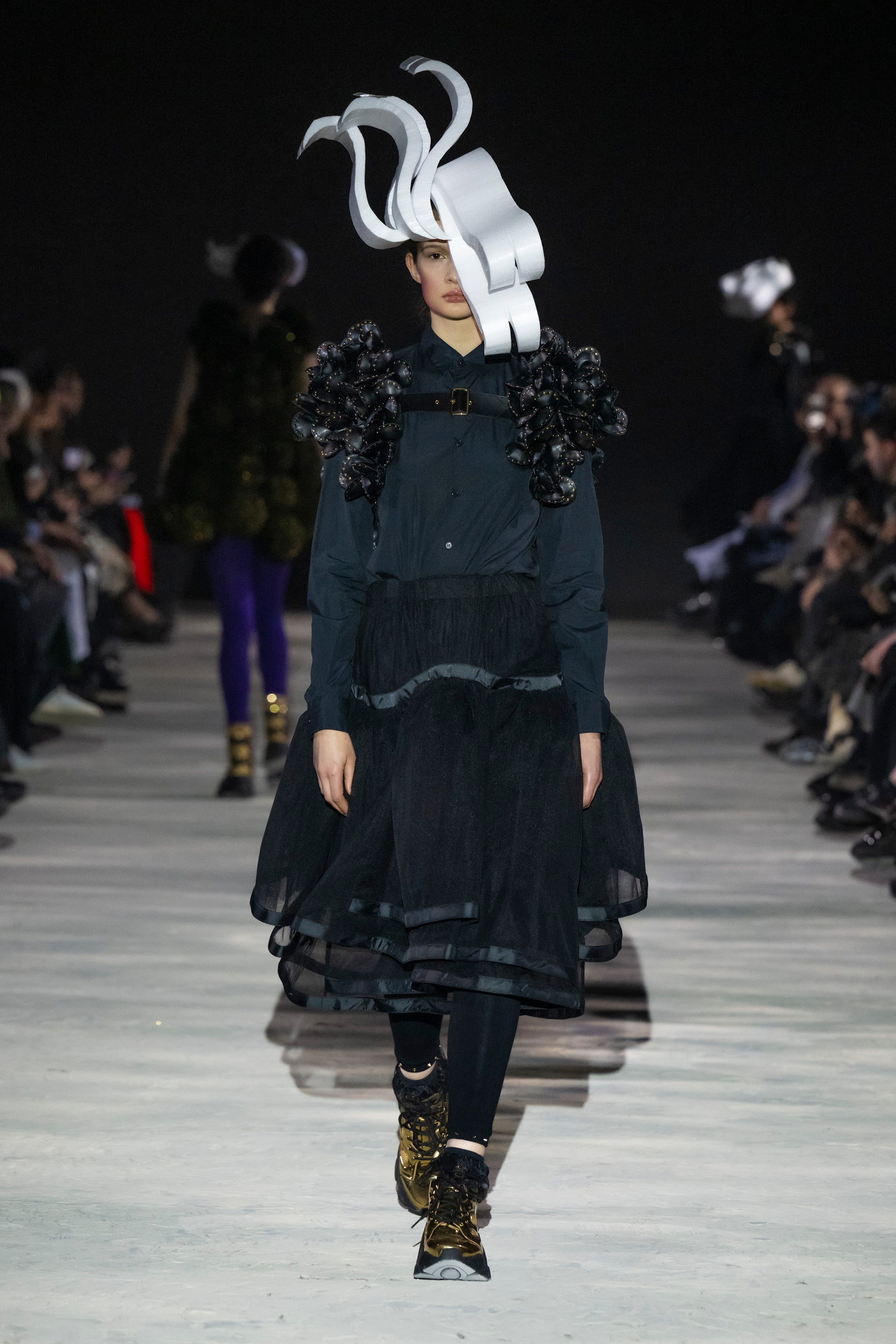 Fashion model wearing a noir kei ninomiya AW25 outfit