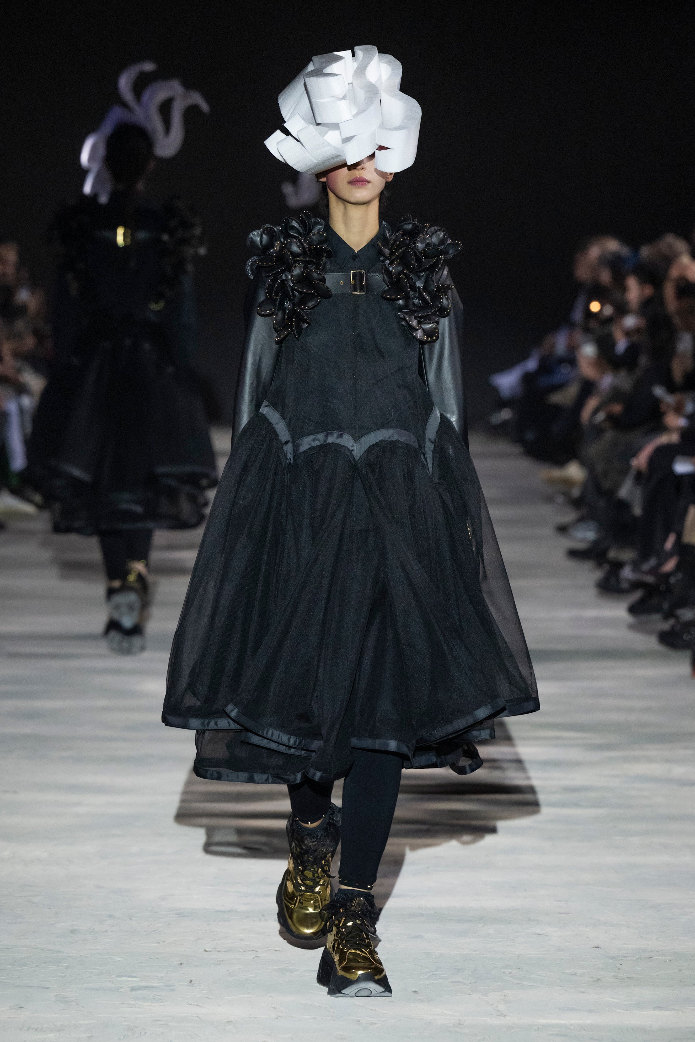 Fashion model wearing a noir kei ninomiya AW25 outfit