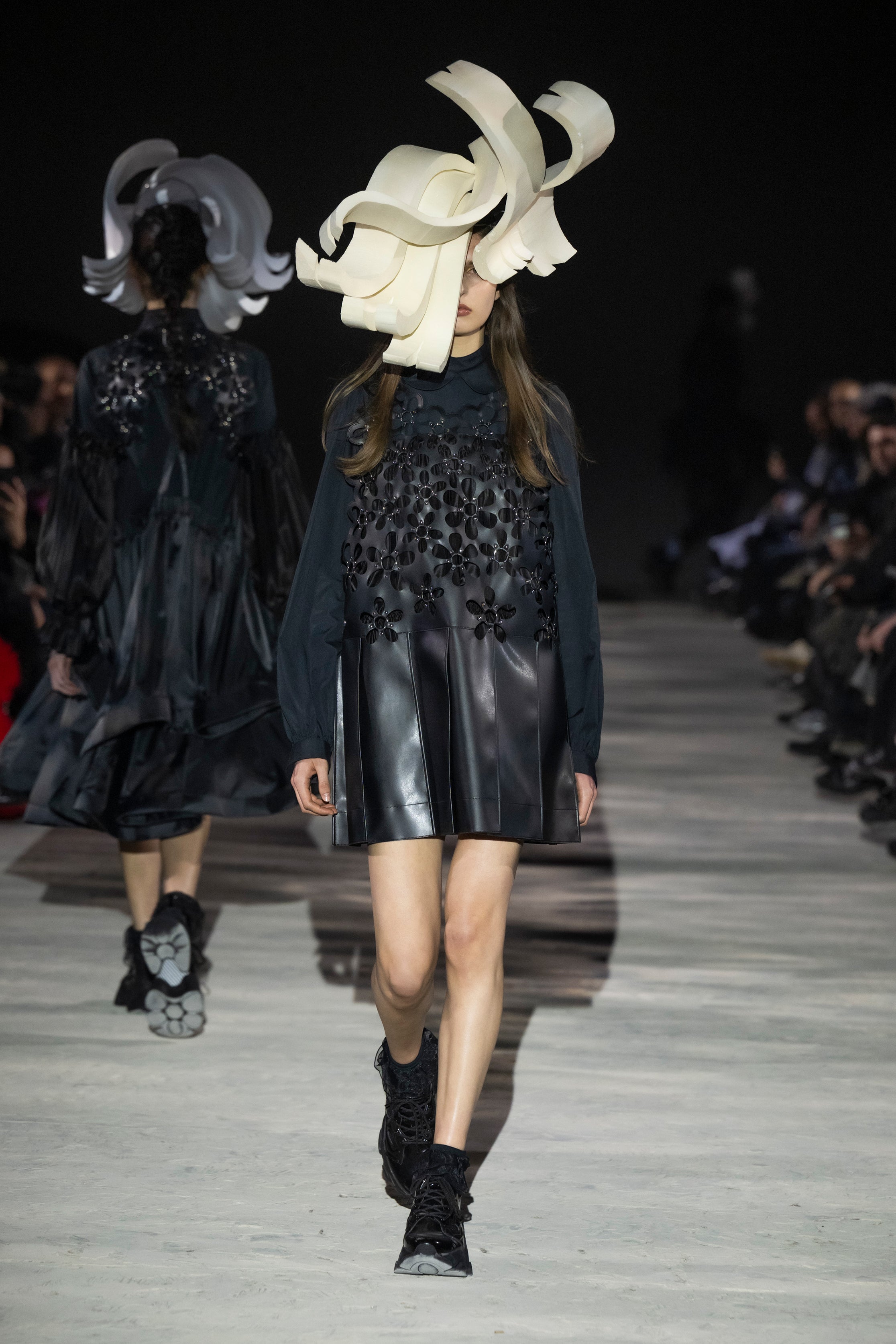 Fashion model wearing a noir kei ninomiya AW25 outfit