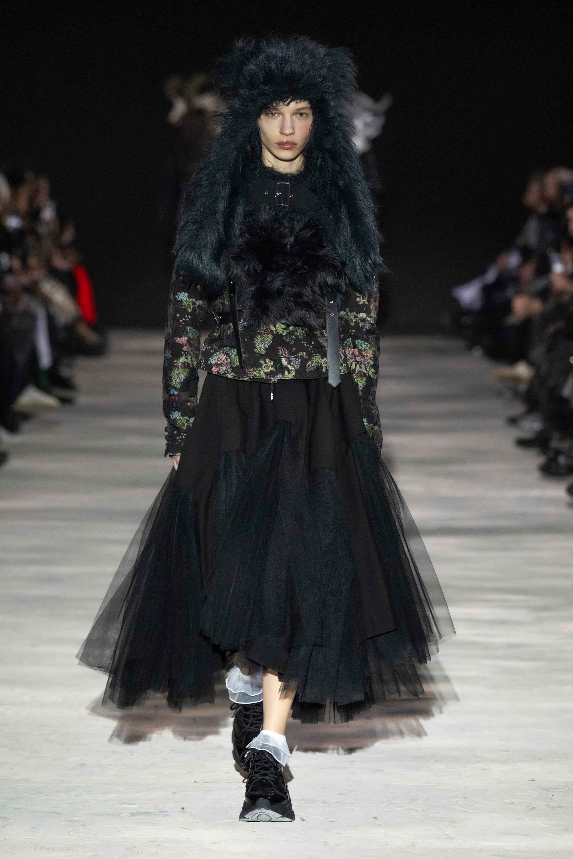 Fashion model wearing a noir kei ninomiya AW25 outfit
