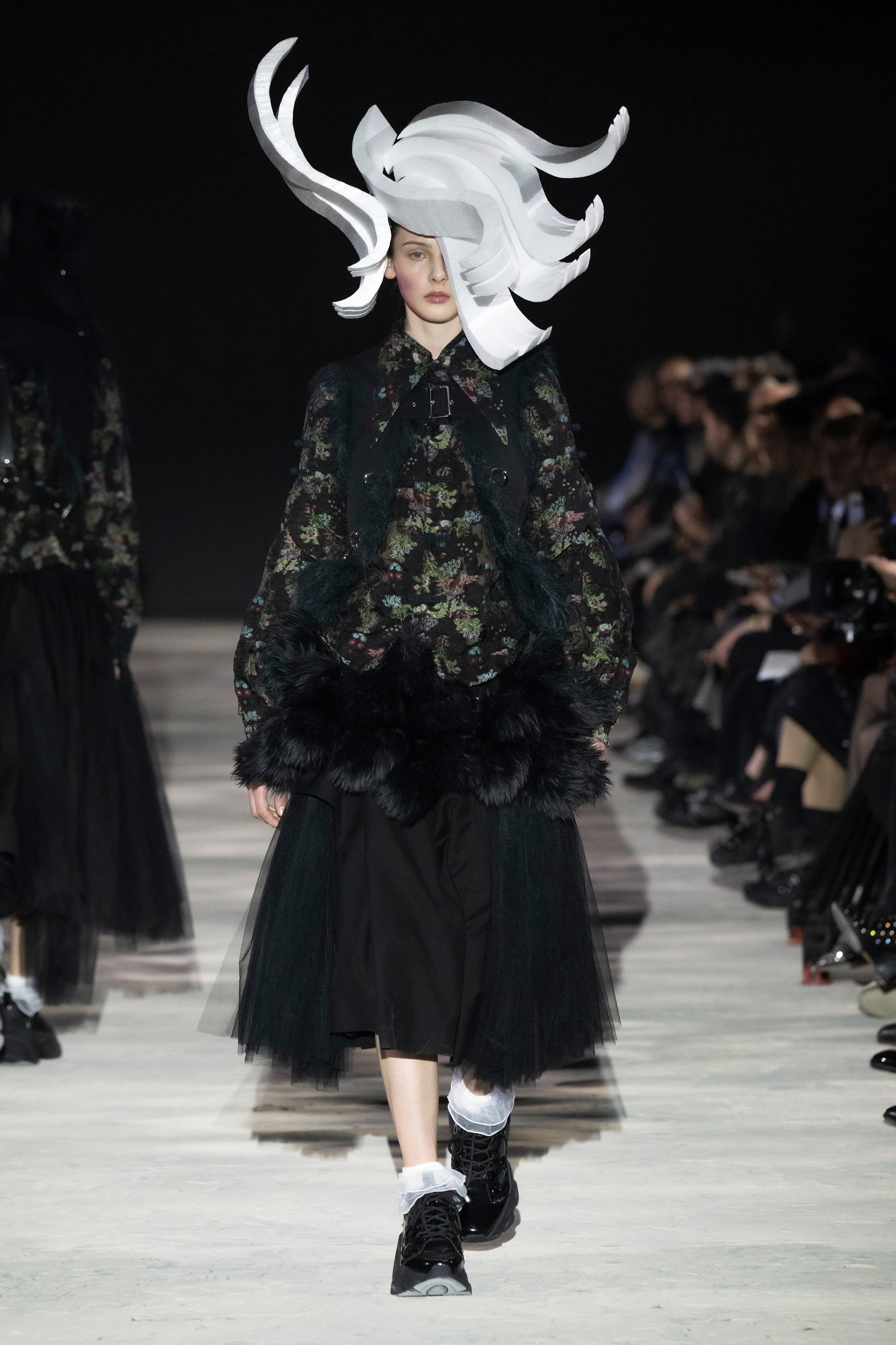 Fashion model wearing a noir kei ninomiya AW25 outfit