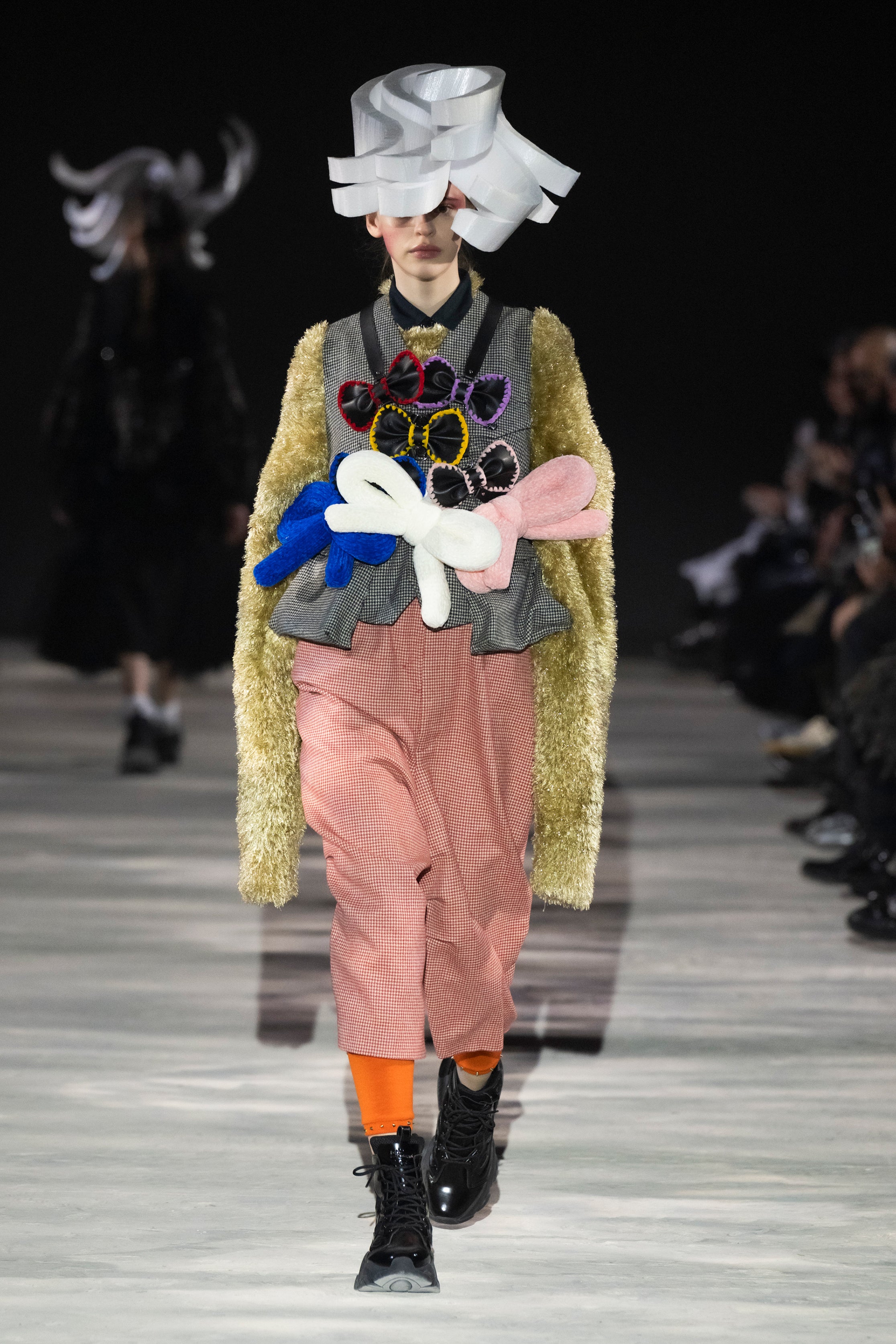 Fashion model wearing a noir kei ninomiya AW25 outfit
