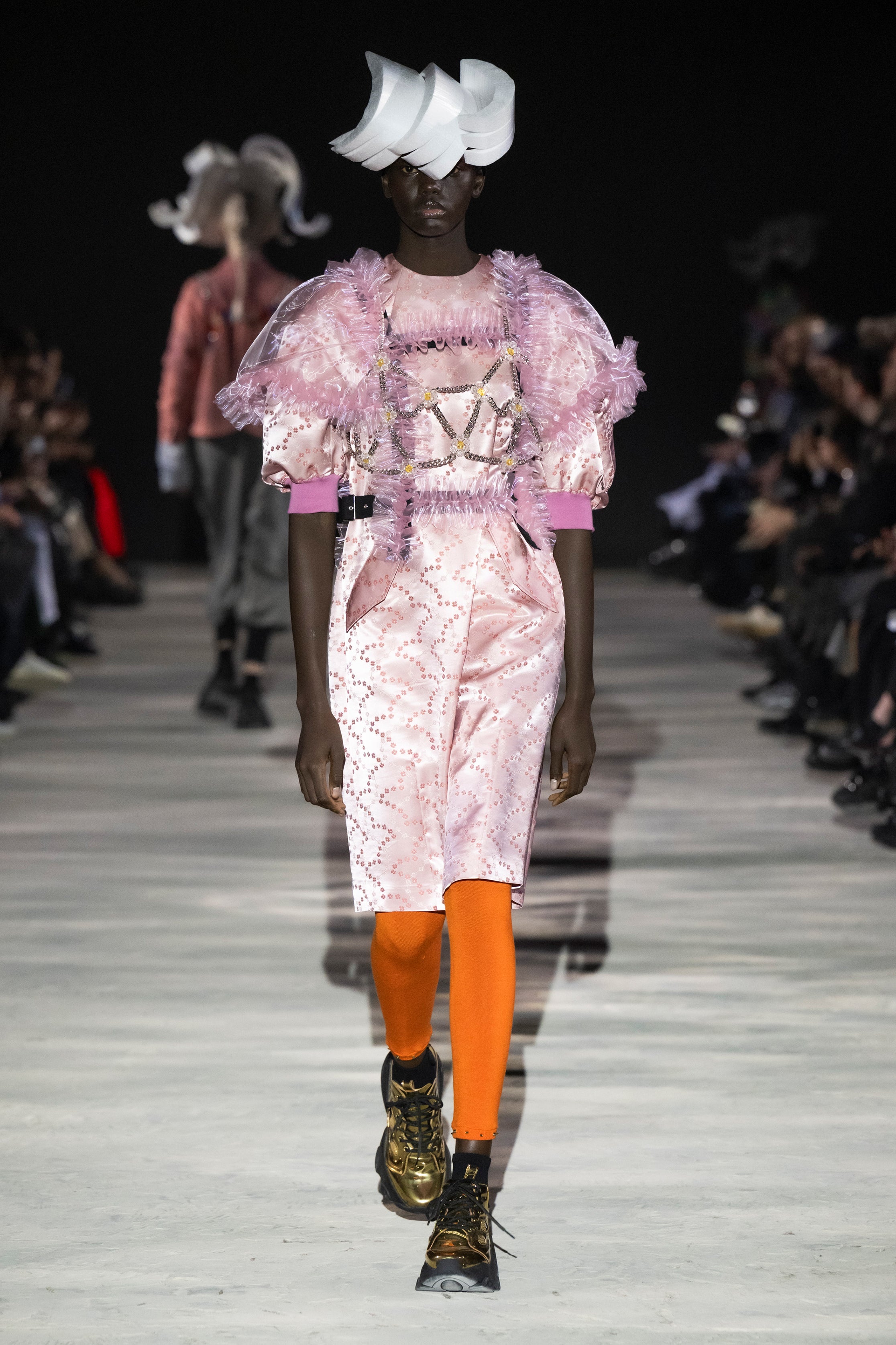 Fashion model wearing a noir kei ninomiya AW25 outfit