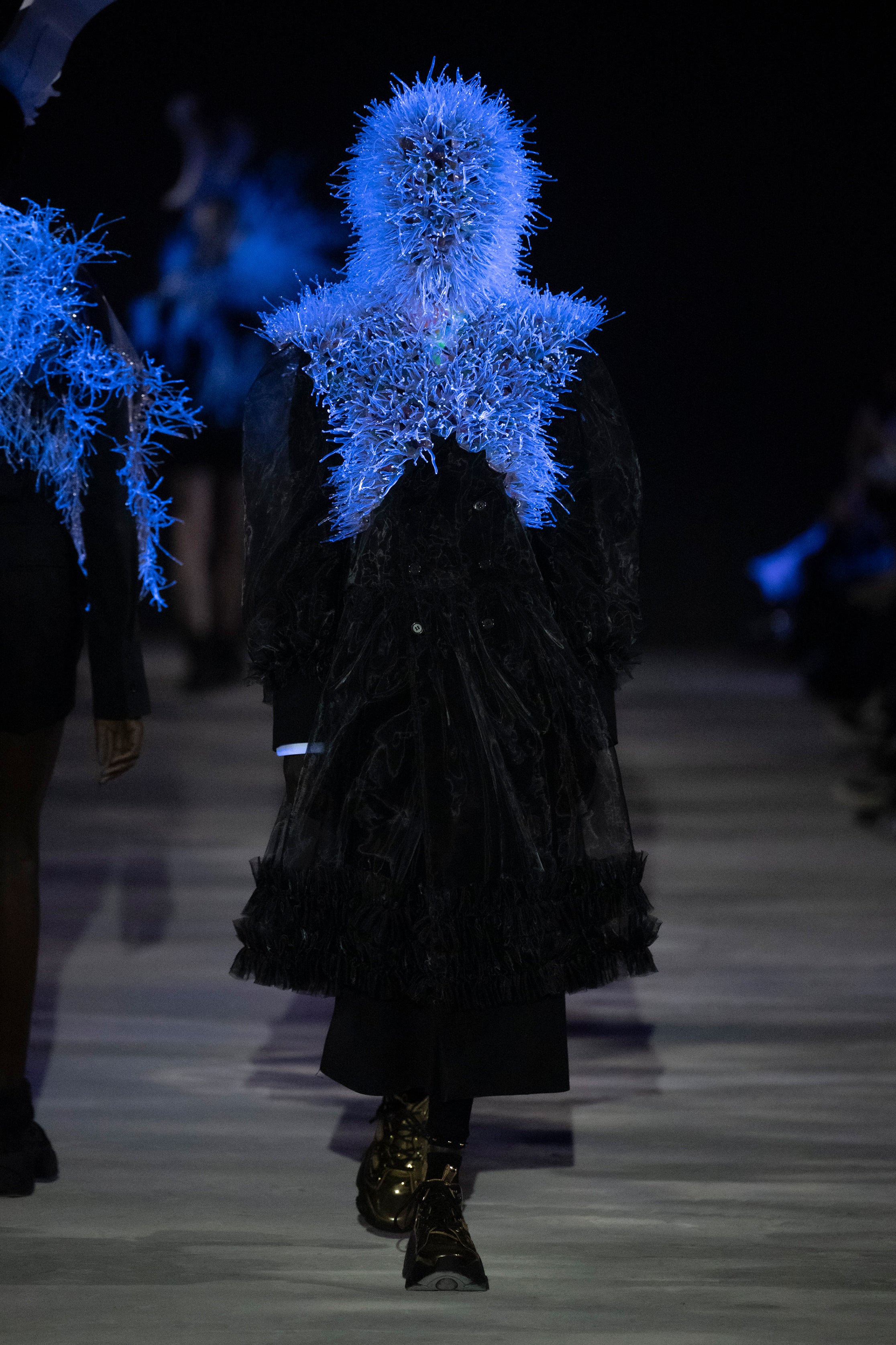 Fashion model wearing a noir kei ninomiya AW25 outfit