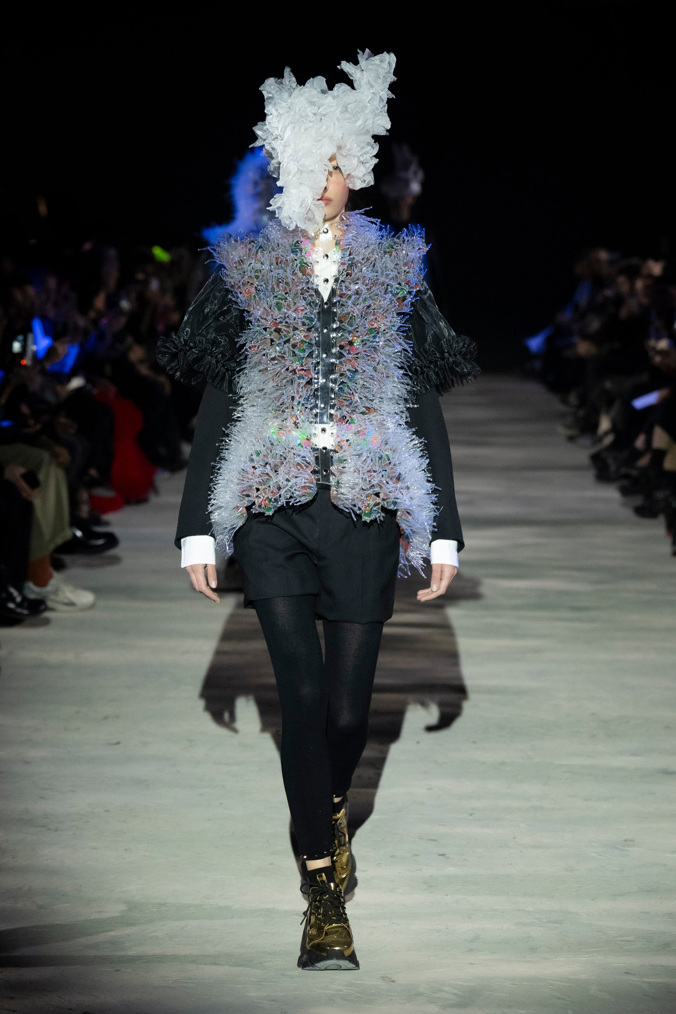 Fashion model wearing a noir kei ninomiya AW25 outfit