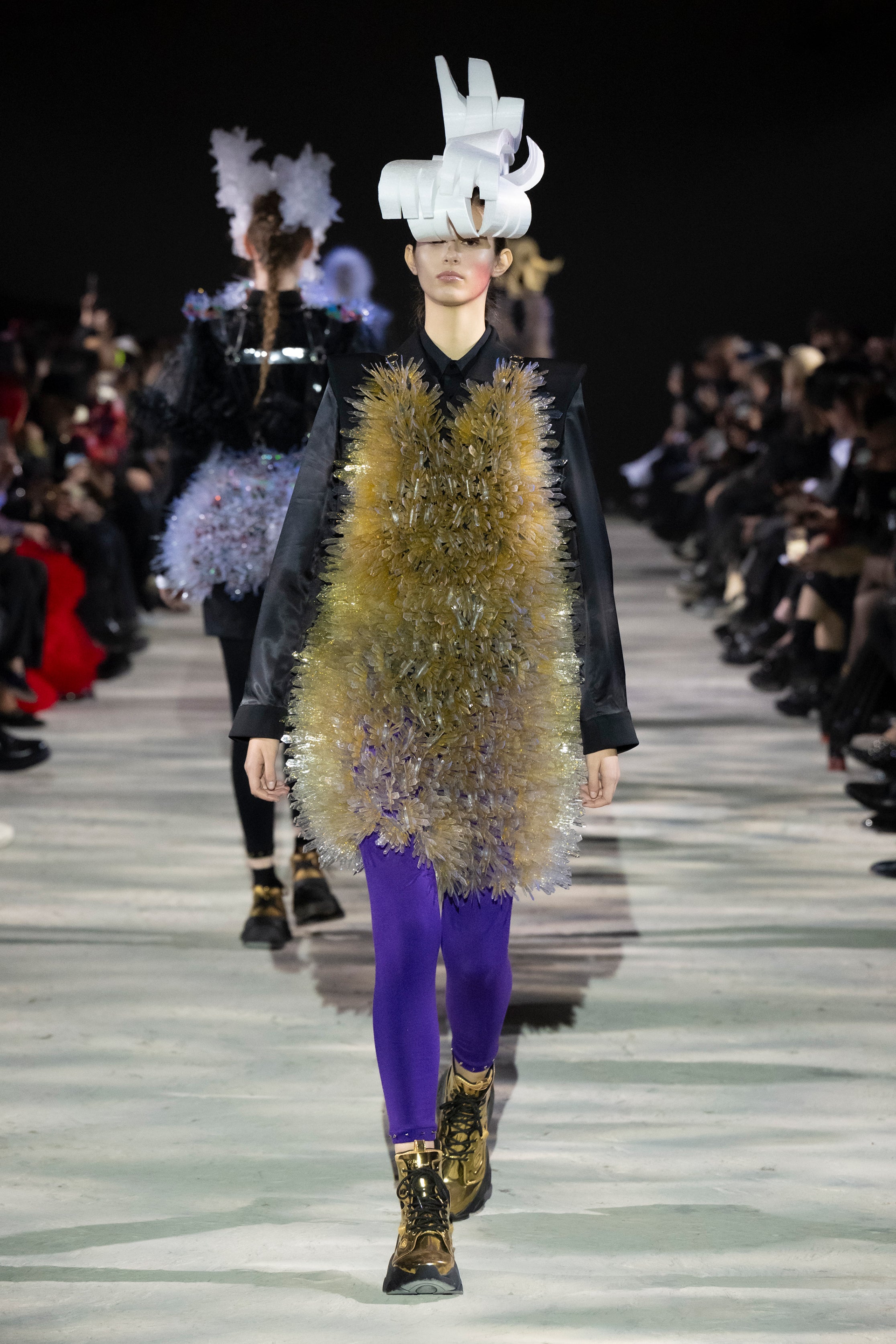 Fashion model wearing a noir kei ninomiya AW25 outfit