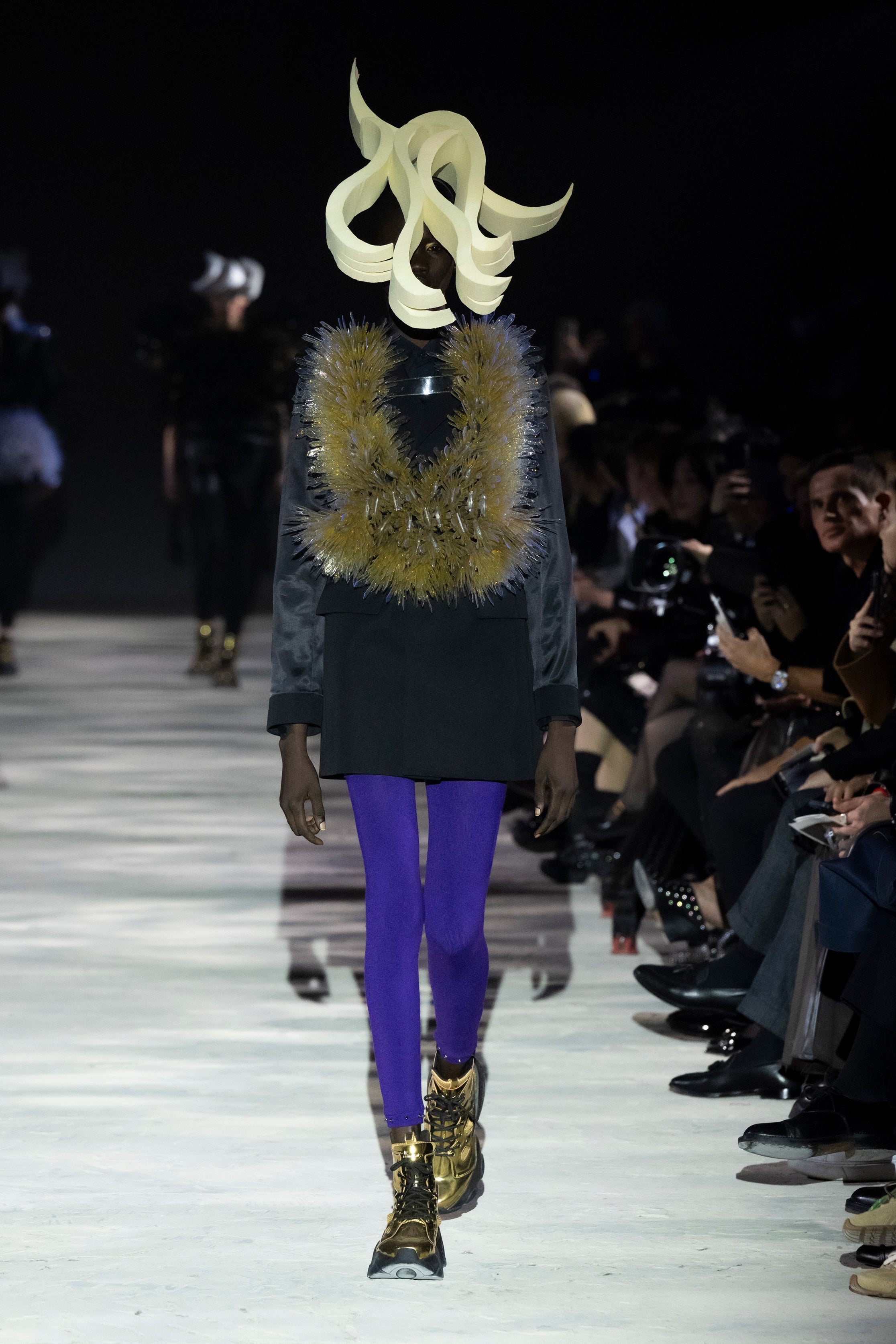 Fashion model wearing a noir kei ninomiya AW25 outfit
