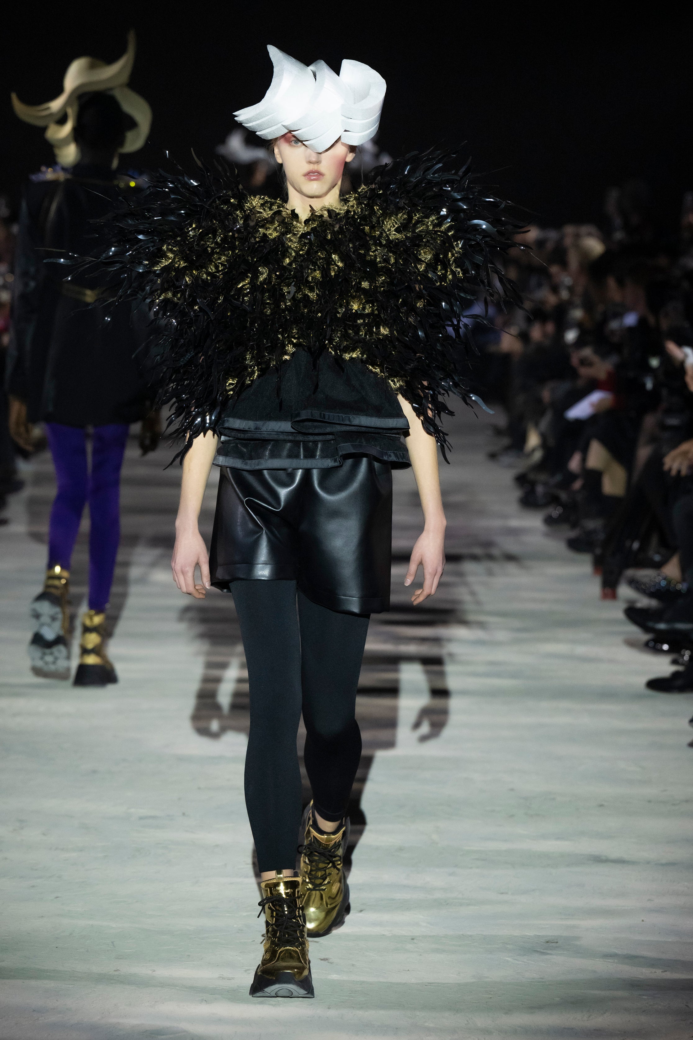 Fashion model wearing a noir kei ninomiya AW25 outfit