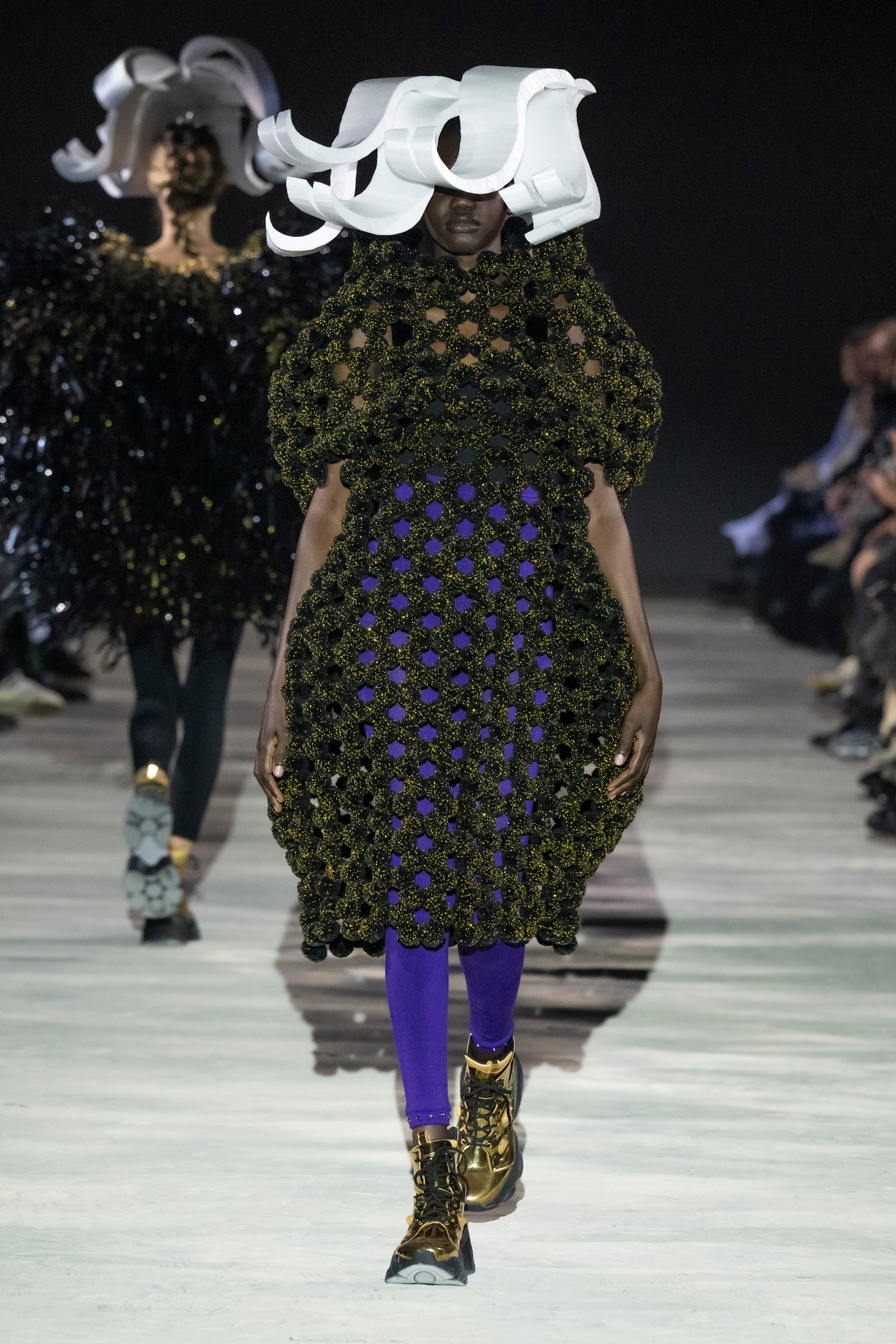 Fashion model wearing a noir kei ninomiya AW25 outfit
