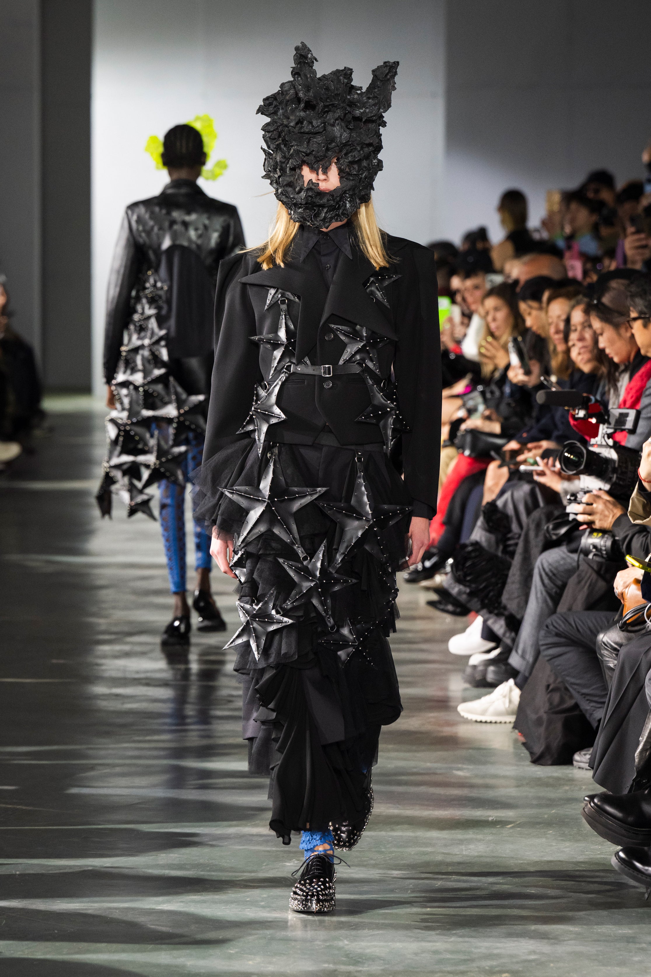 Fashion model wearing a Noir Kei Ninomiya SS26 outfit