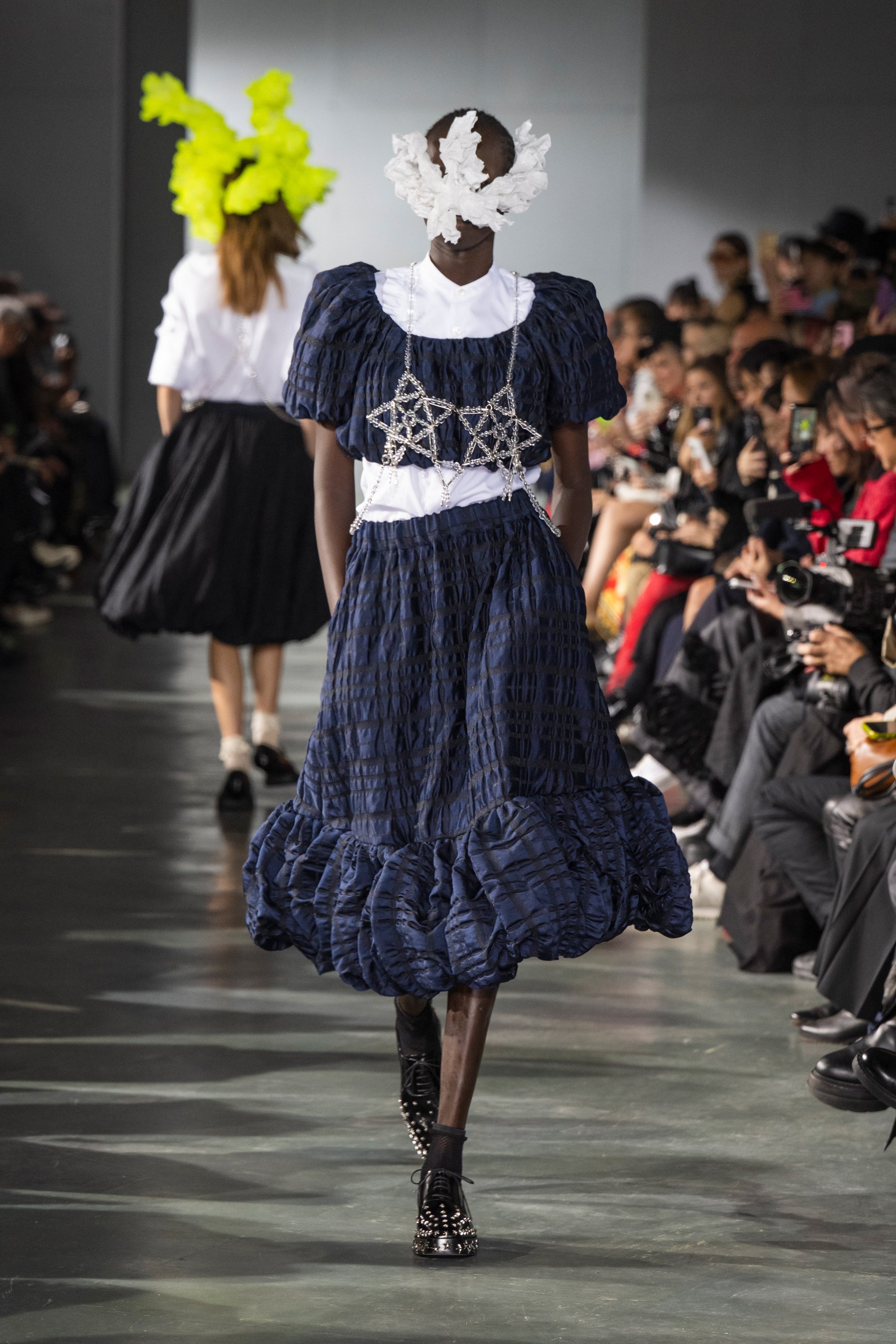 Fashion model wearing a Noir Kei Ninomiya SS26 outfit