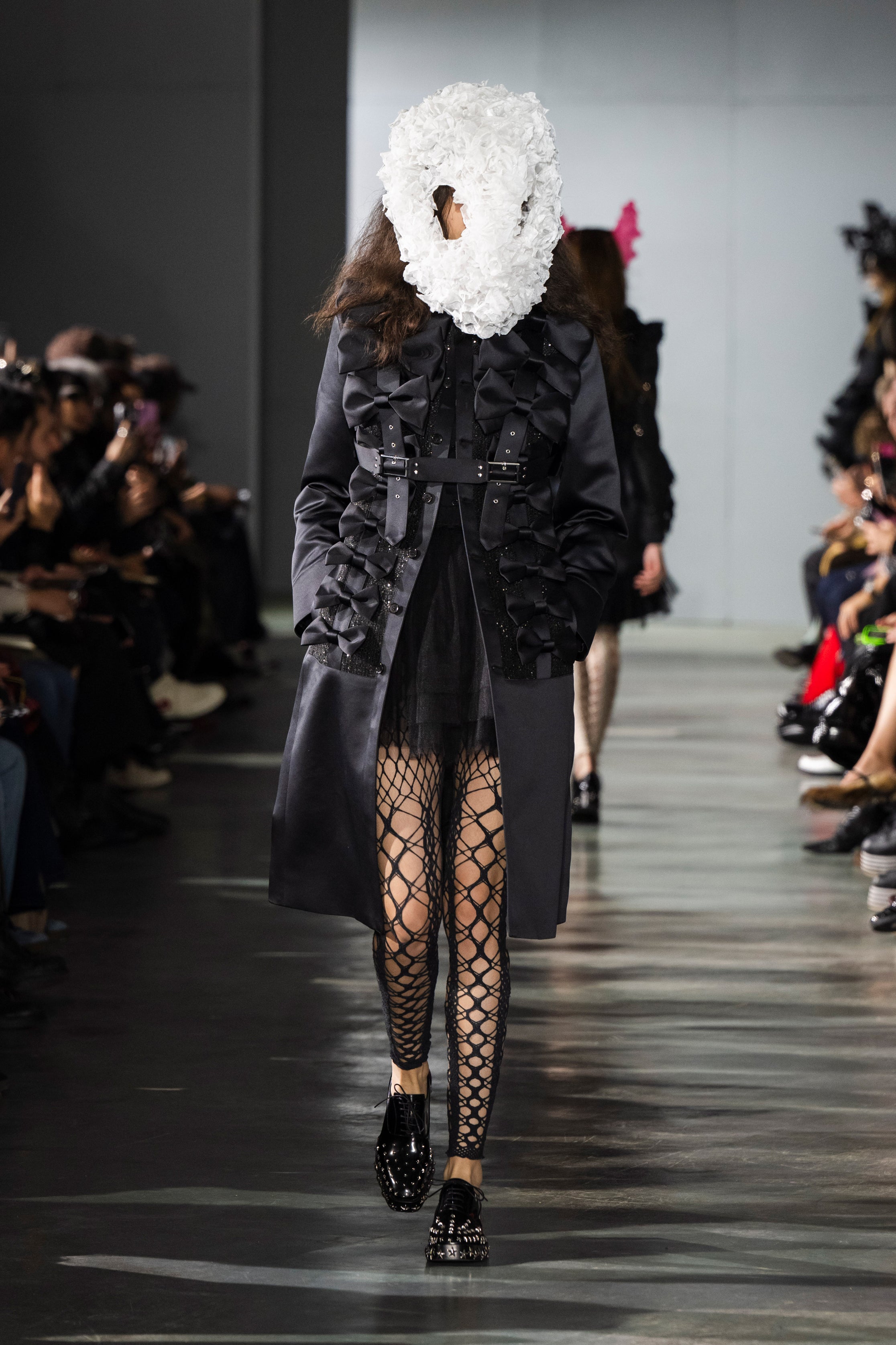 Fashion model wearing a Noir Kei Ninomiya SS26 outfit