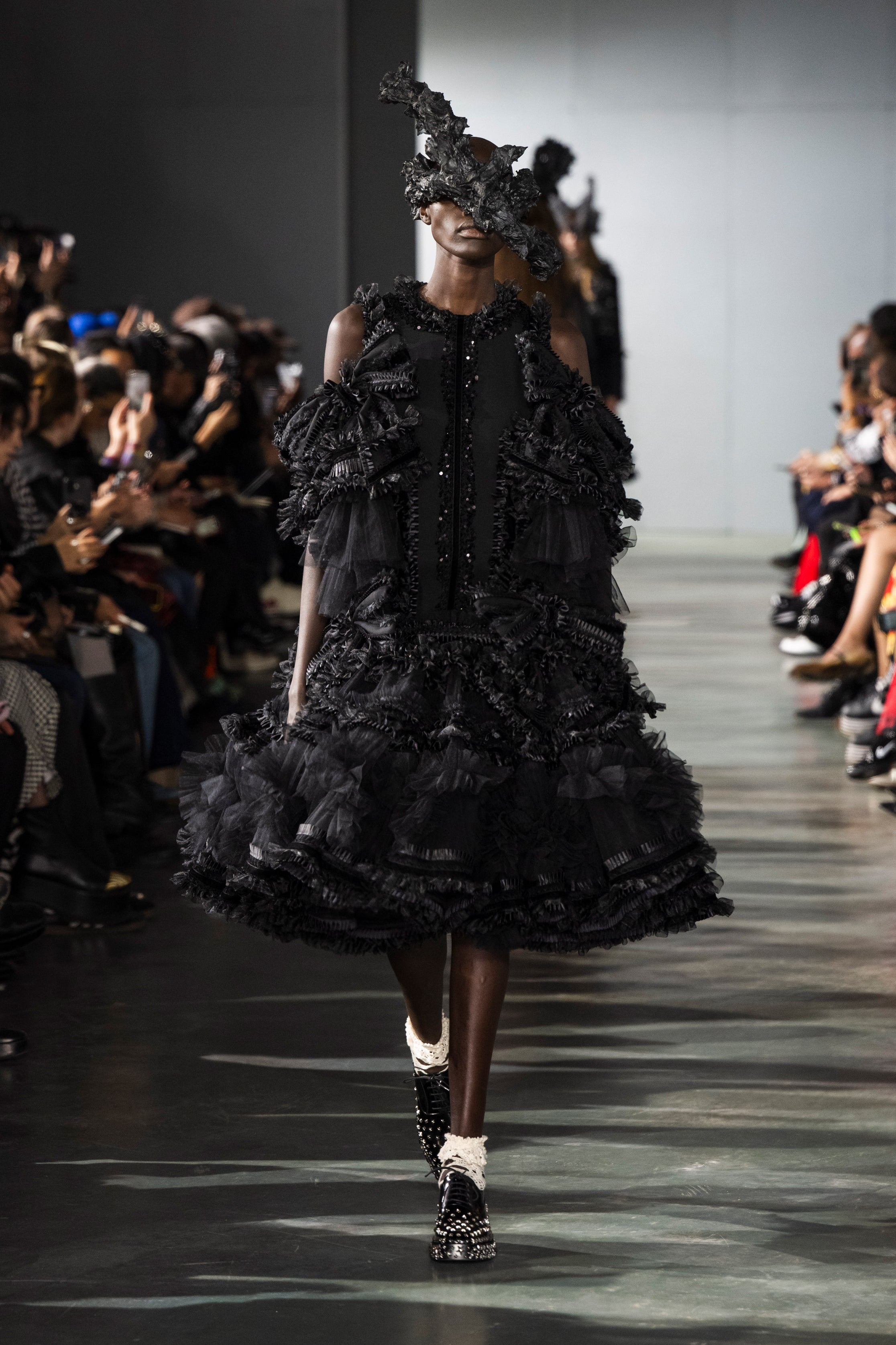 Fashion model wearing a Noir Kei Ninomiya SS26 outfit