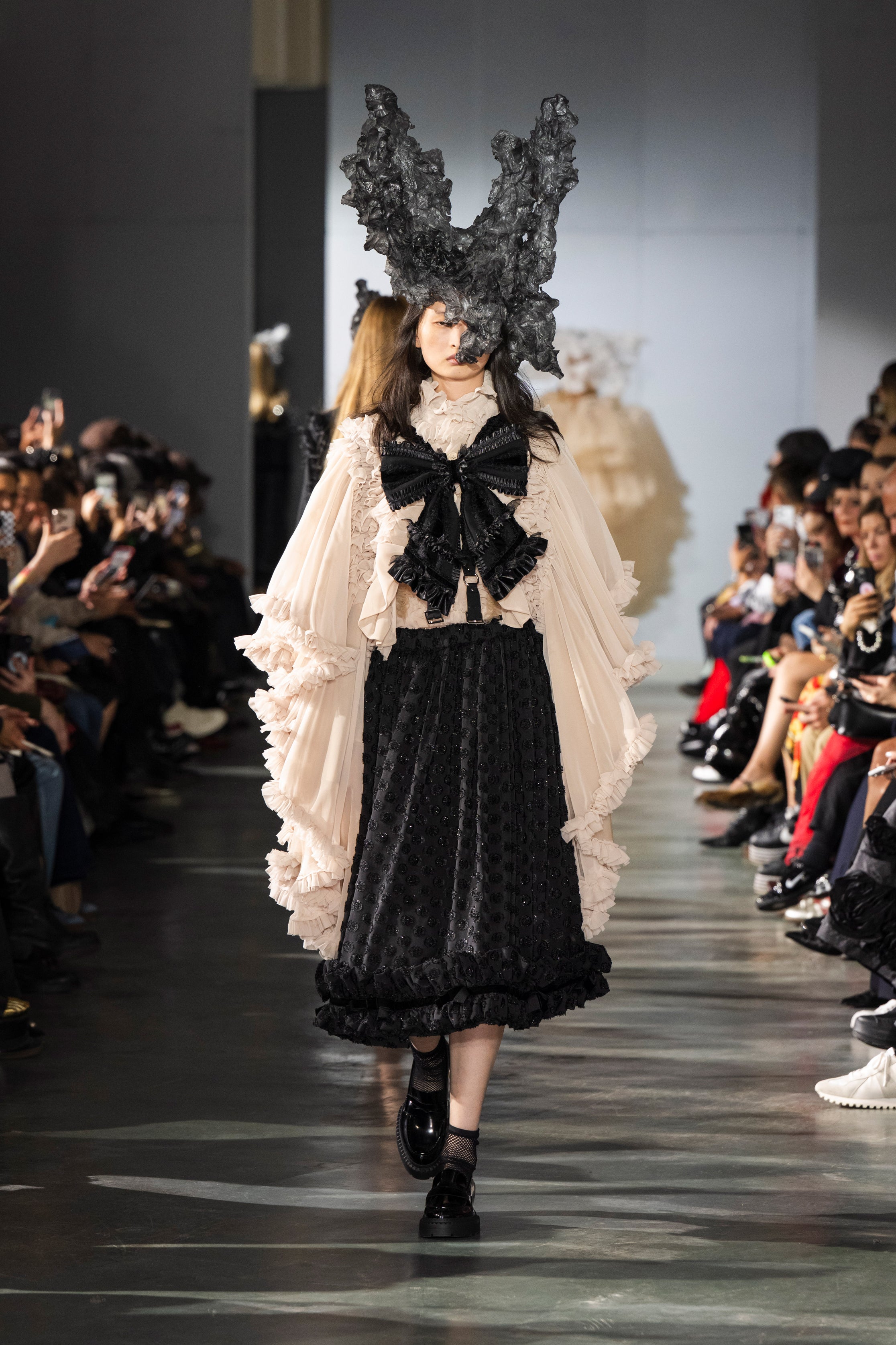 Fashion model wearing a Noir Kei Ninomiya SS26 outfit