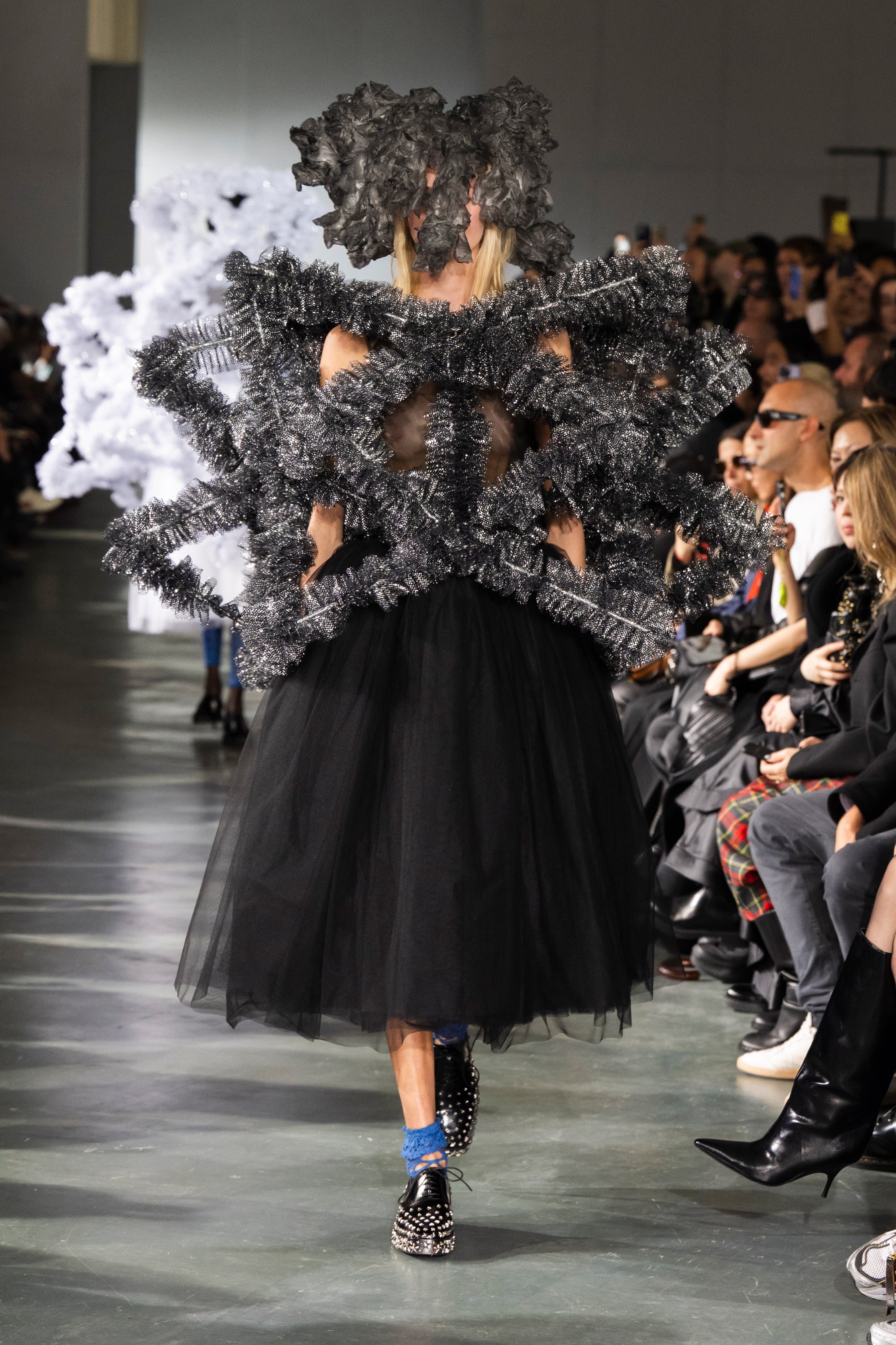 Fashion model wearing a Noir Kei Ninomiya SS26 outfit