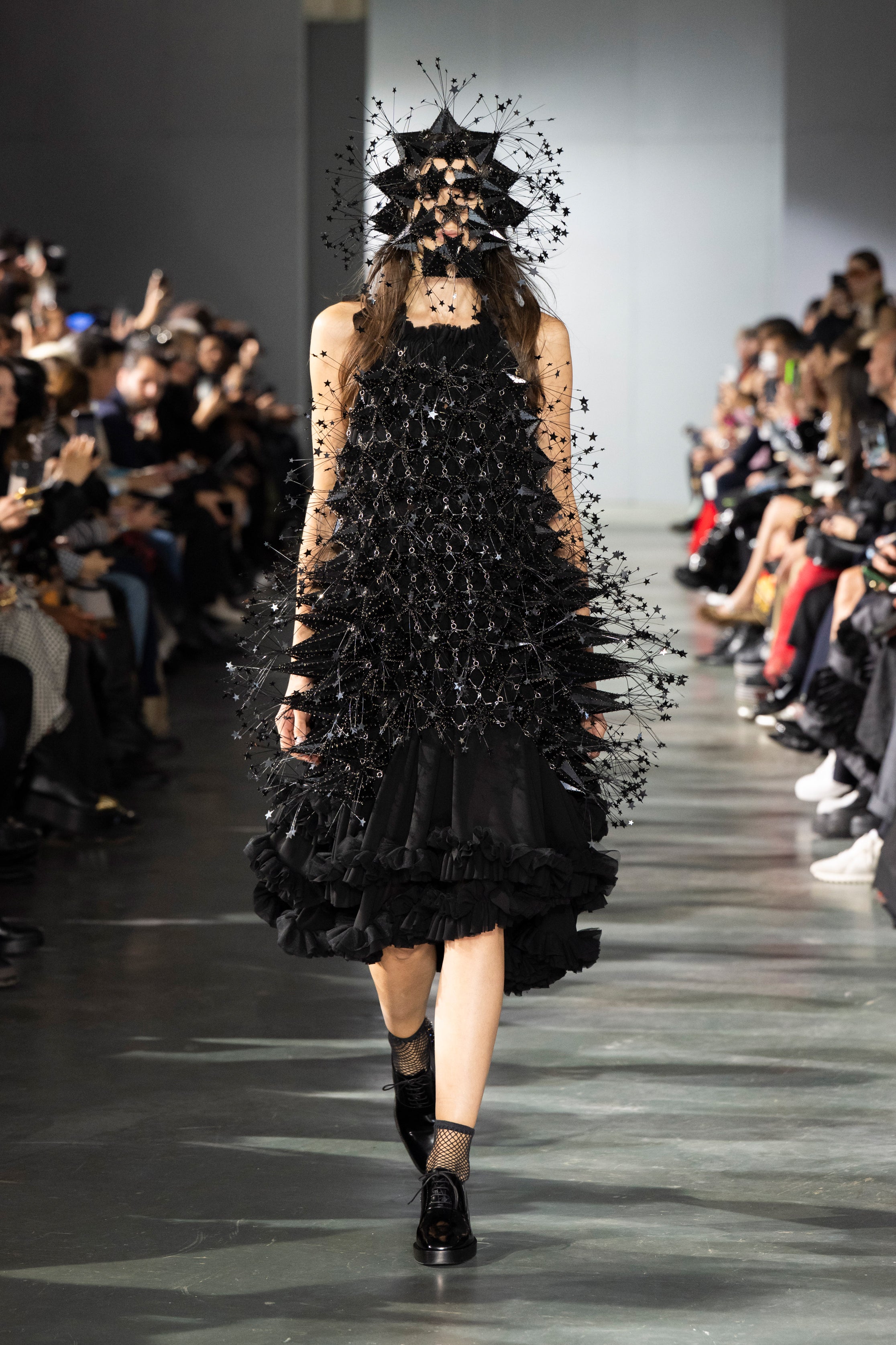 Fashion model wearing a Noir Kei Ninomiya SS26 outfit