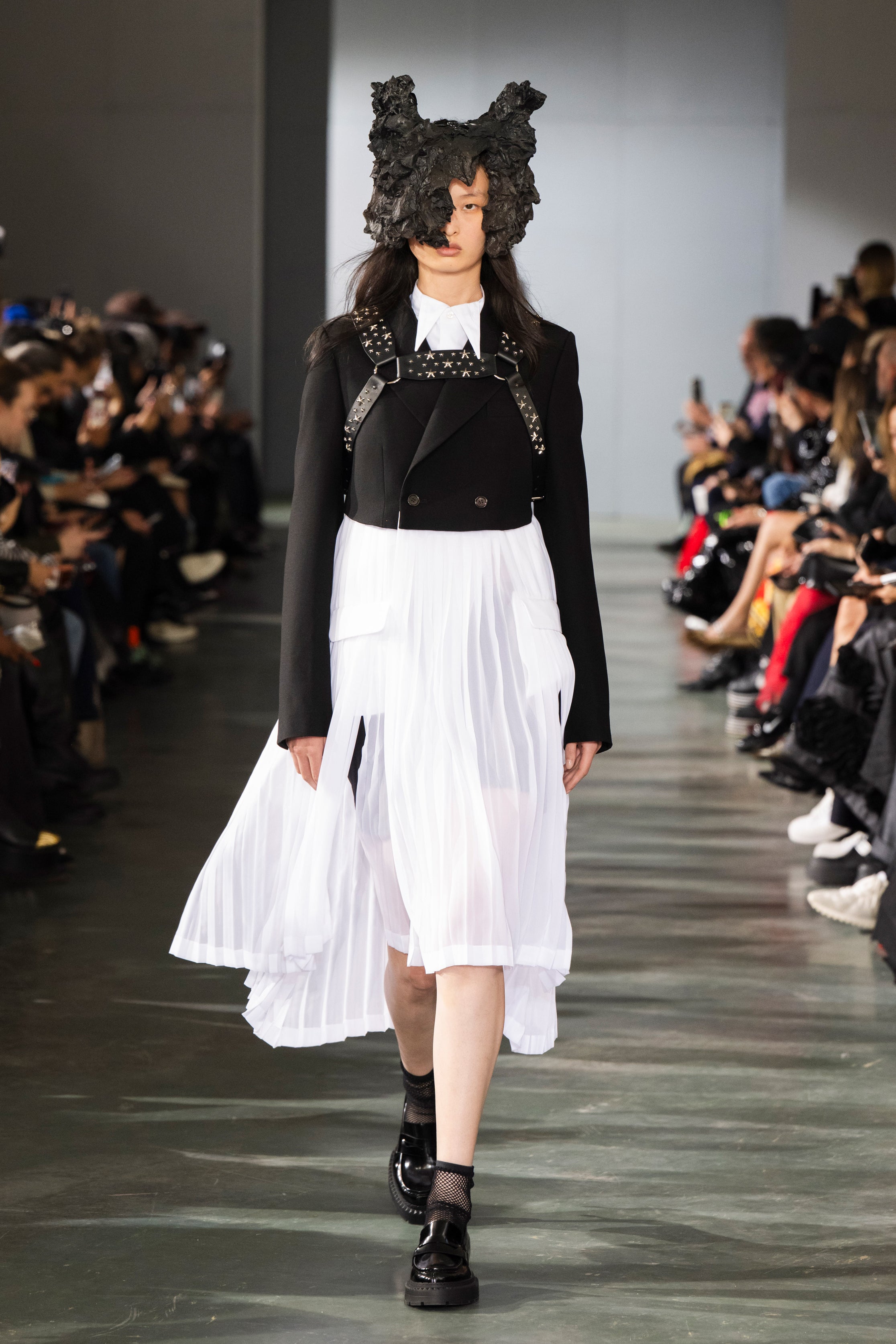 Fashion model wearing a Noir Kei Ninomiya SS26 outfit