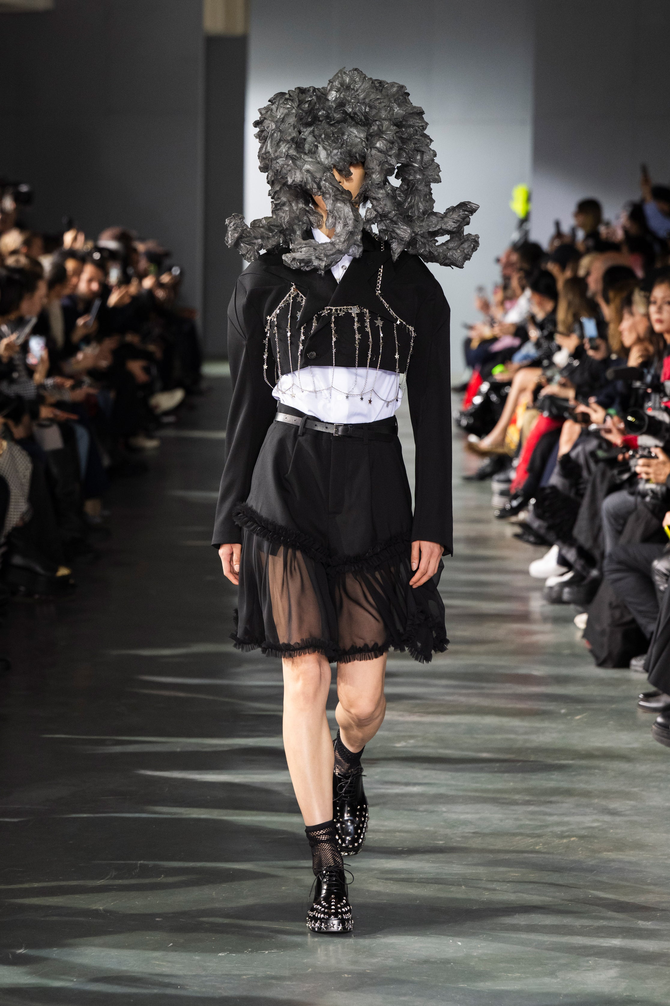 Fashion model wearing a Noir Kei Ninomiya SS26 outfit