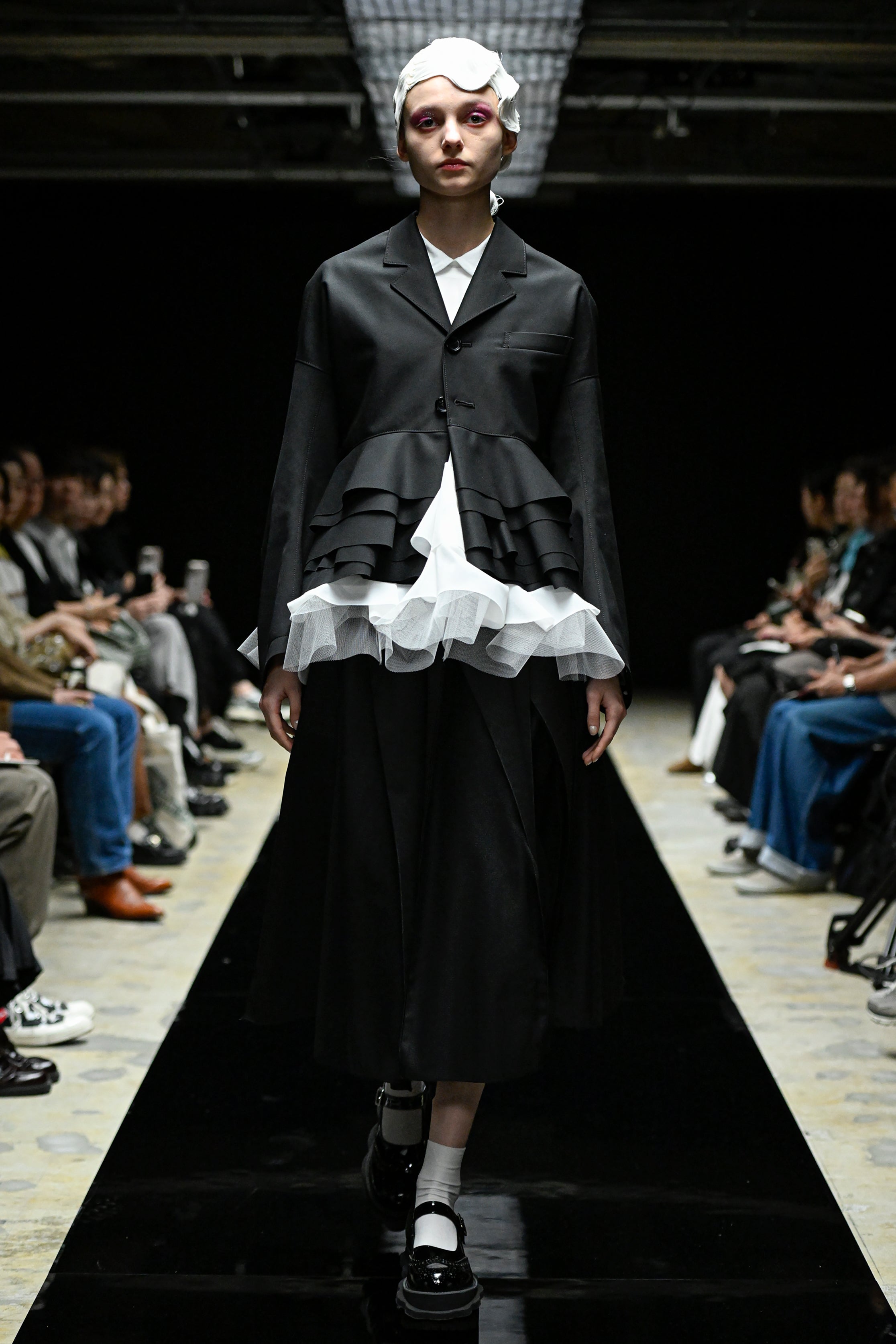 Fashion model wearing a tao AW25 outfit