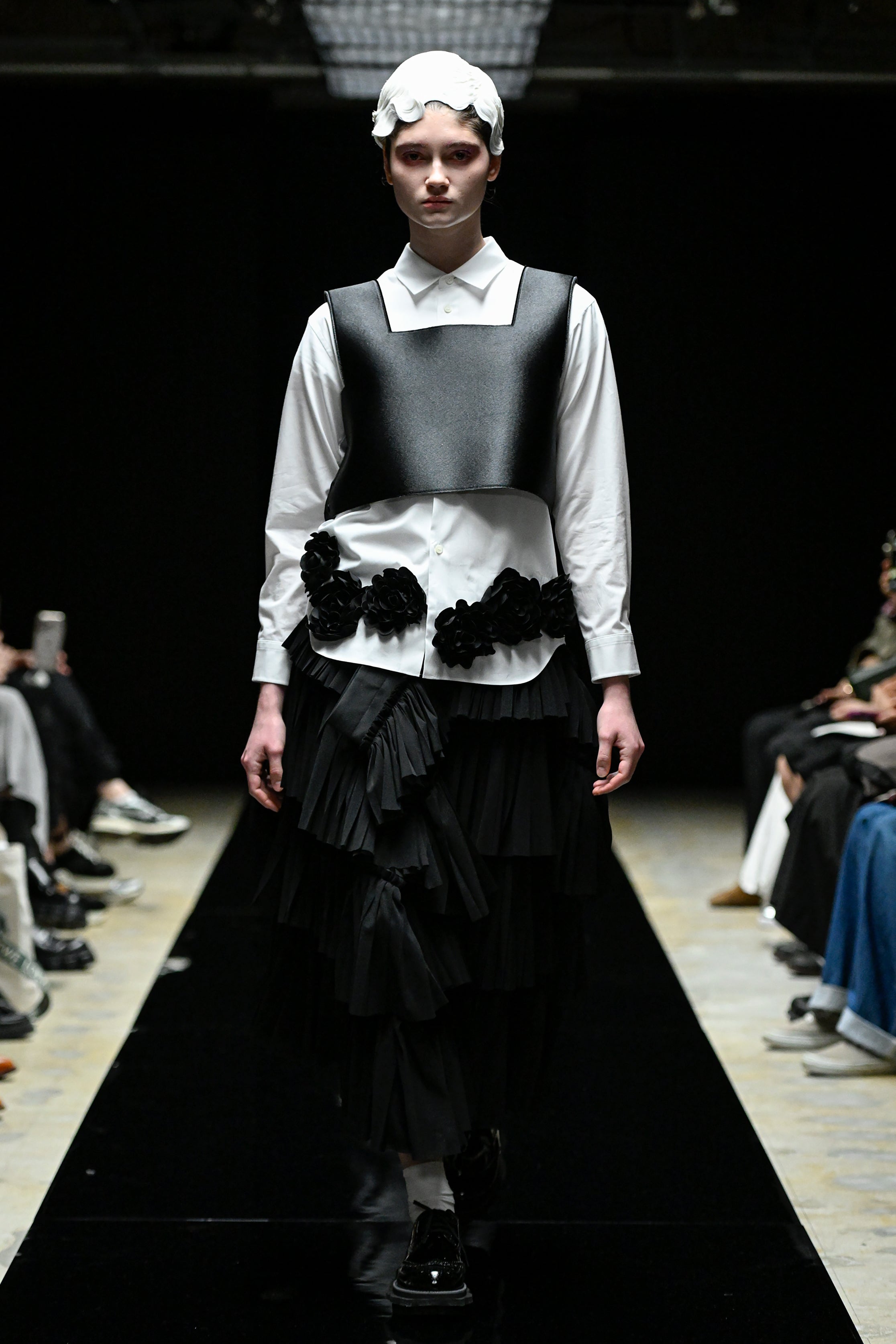 Fashion model wearing a tao AW25 outfit