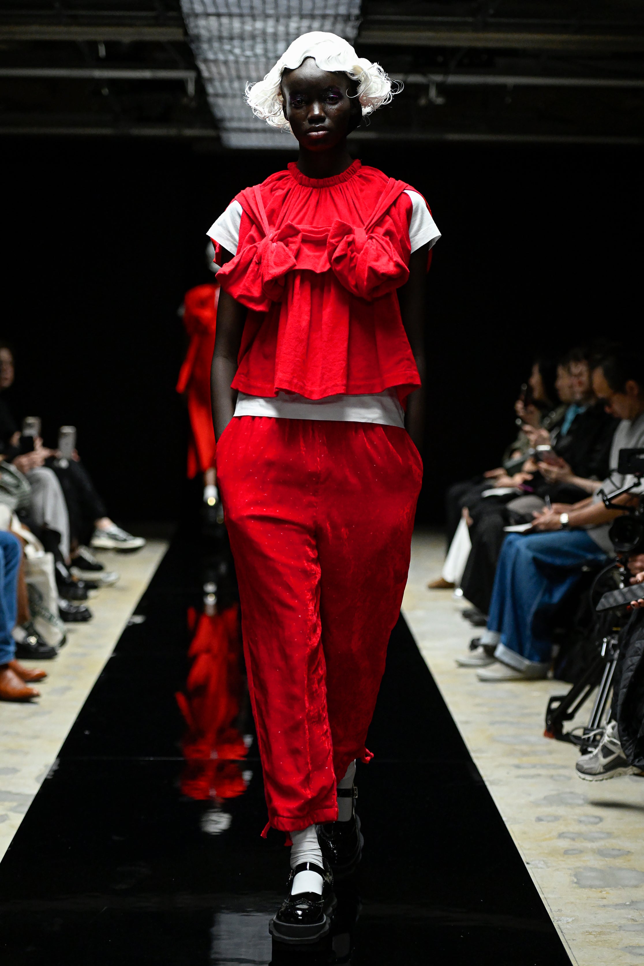 Fashion model wearing a tao AW25 outfit