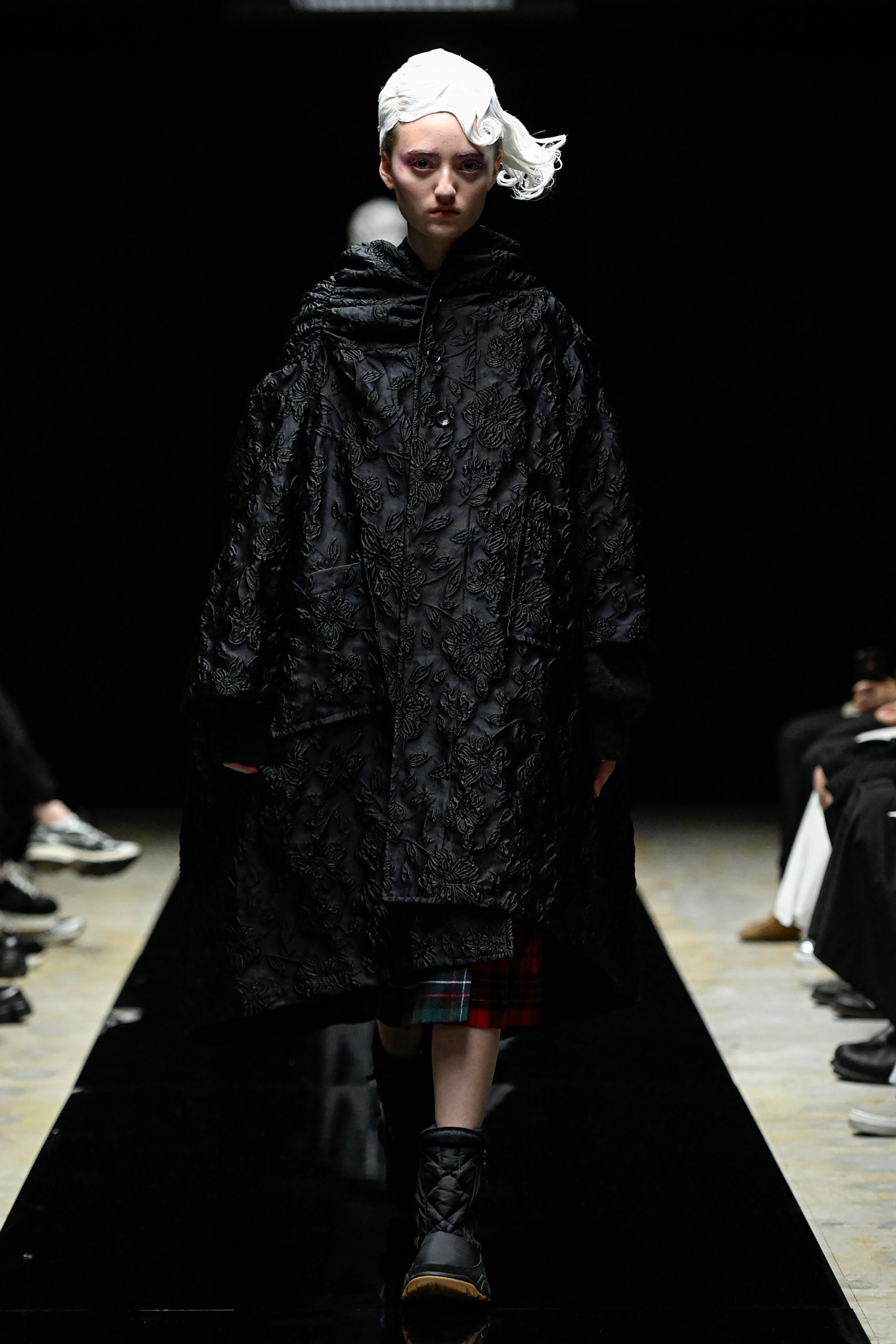 Fashion model wearing a tao AW25 outfit