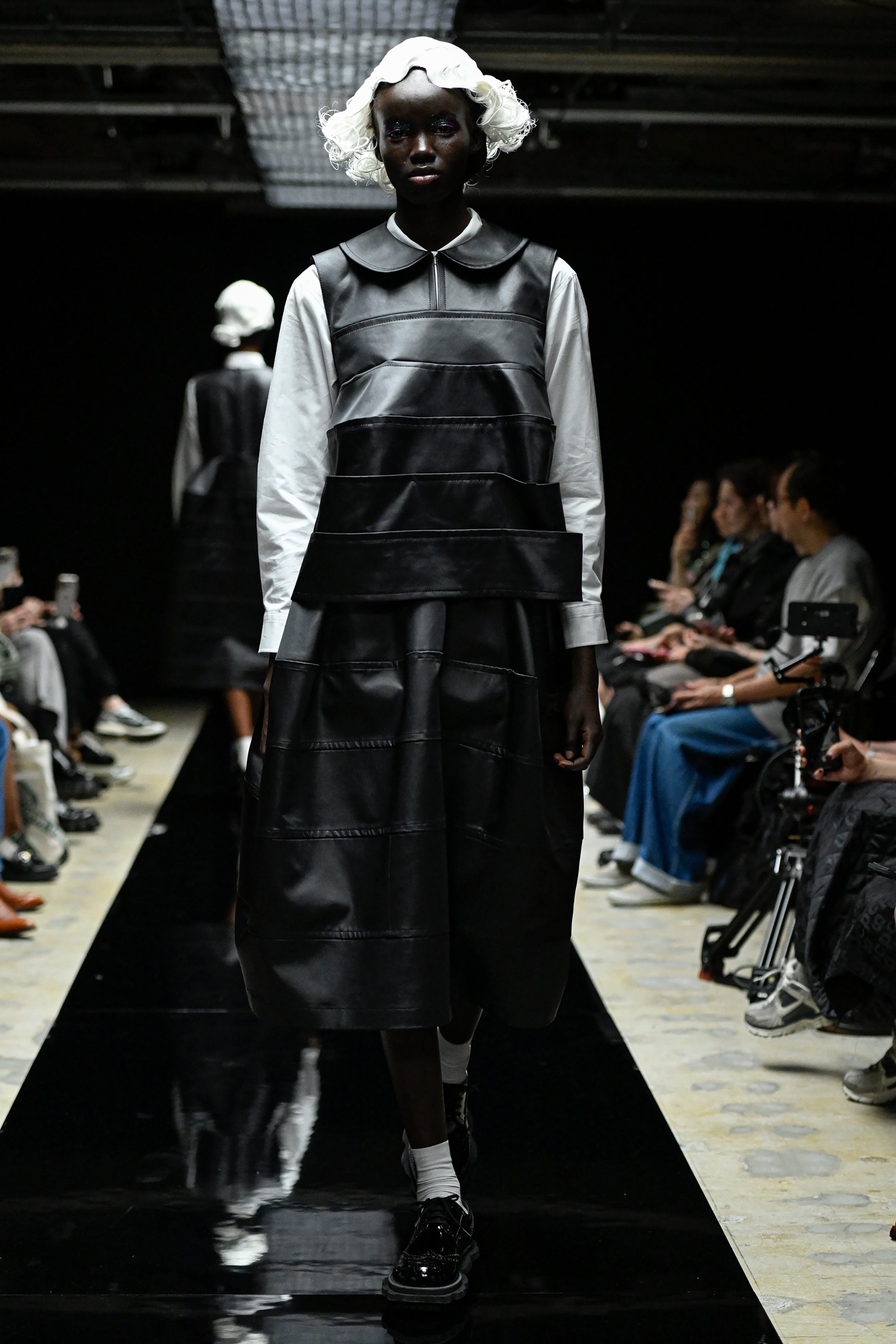 Fashion model wearing a tao AW25 outfit