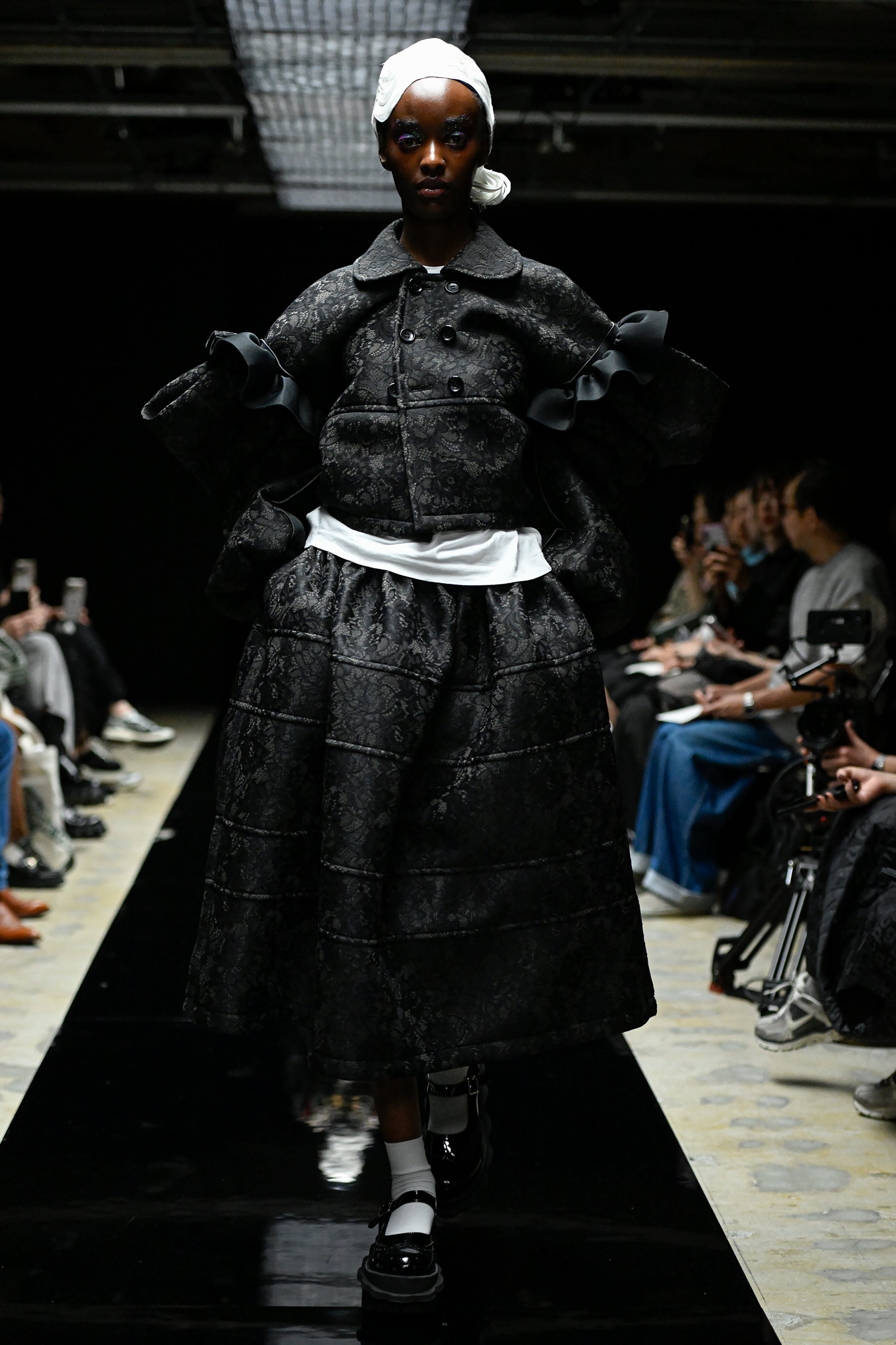 Fashion model wearing a tao AW25 outfit