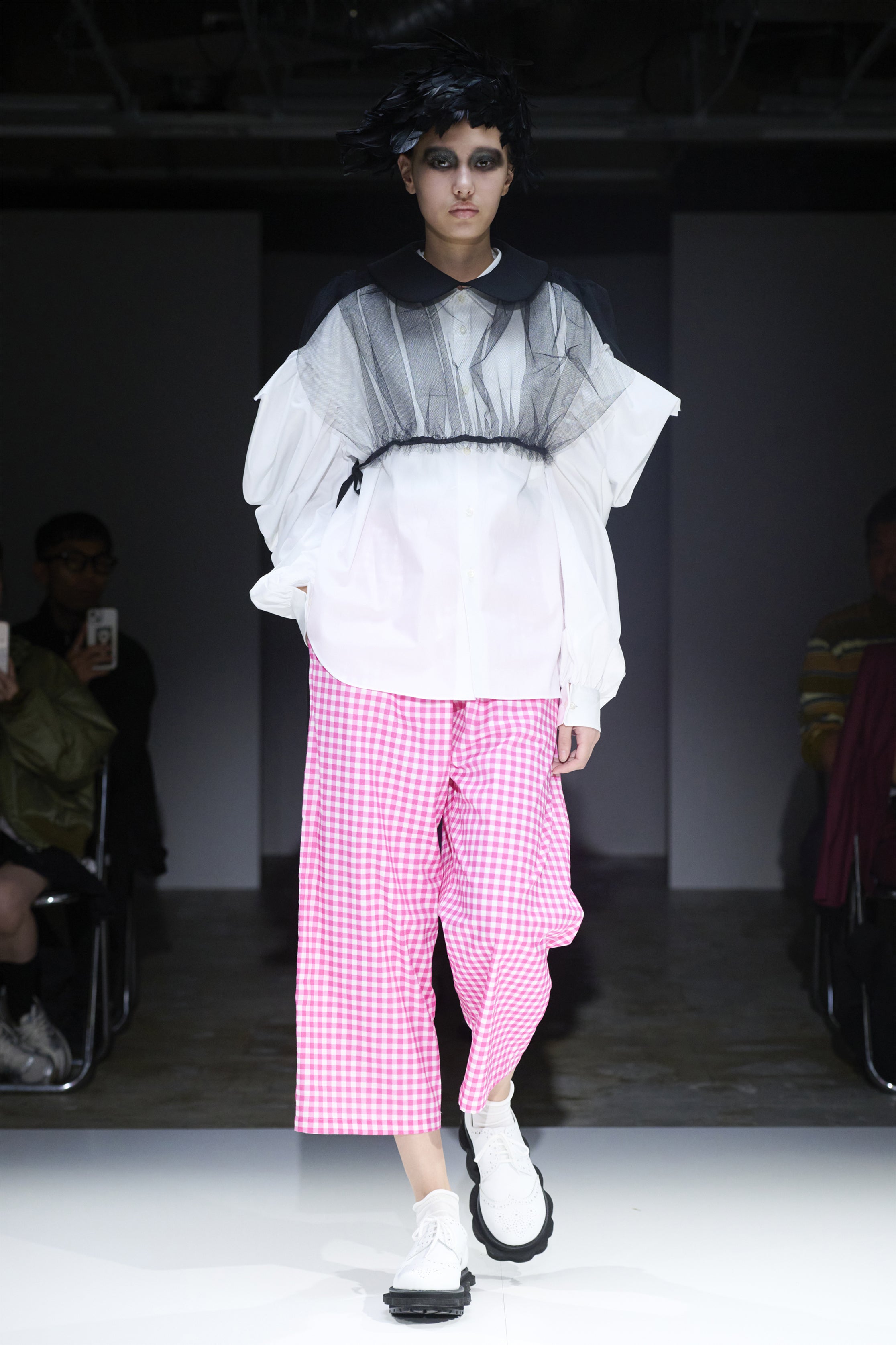 Fashion model wearing a tao SS25 outfit