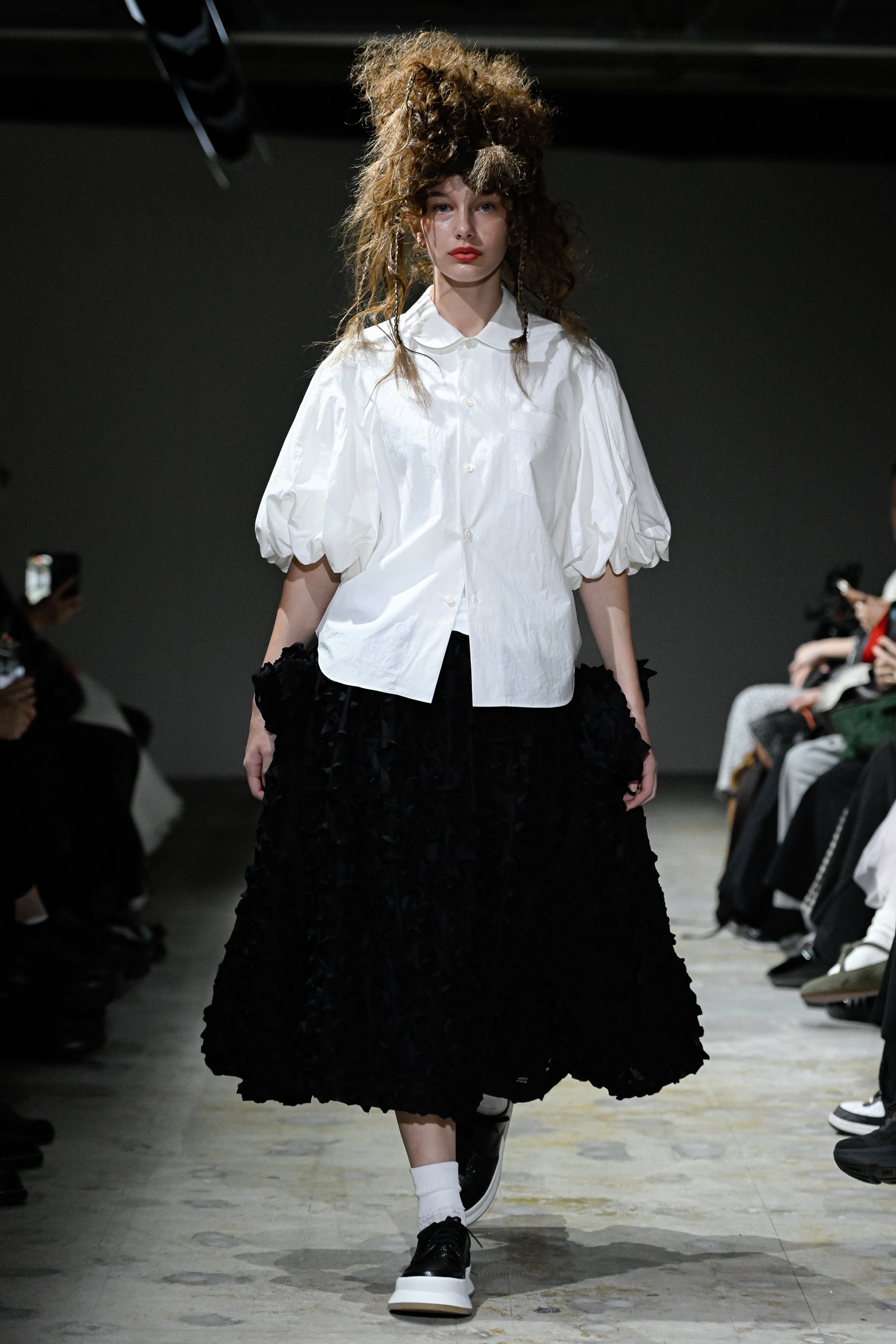 Fashion model wearing a tao SS26 outfit