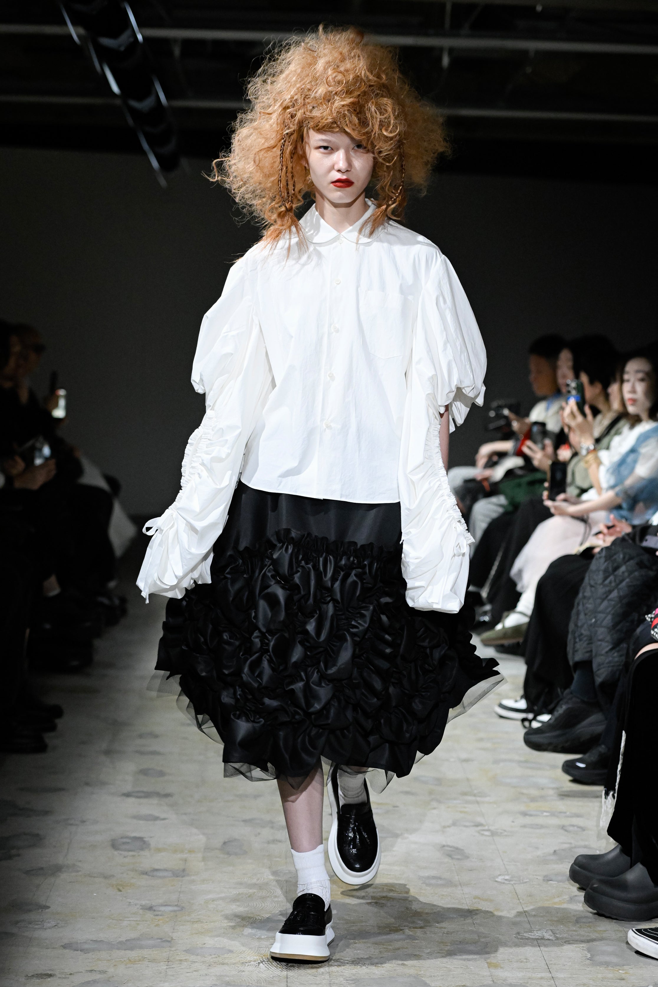 Fashion model wearing a tao SS26 outfit