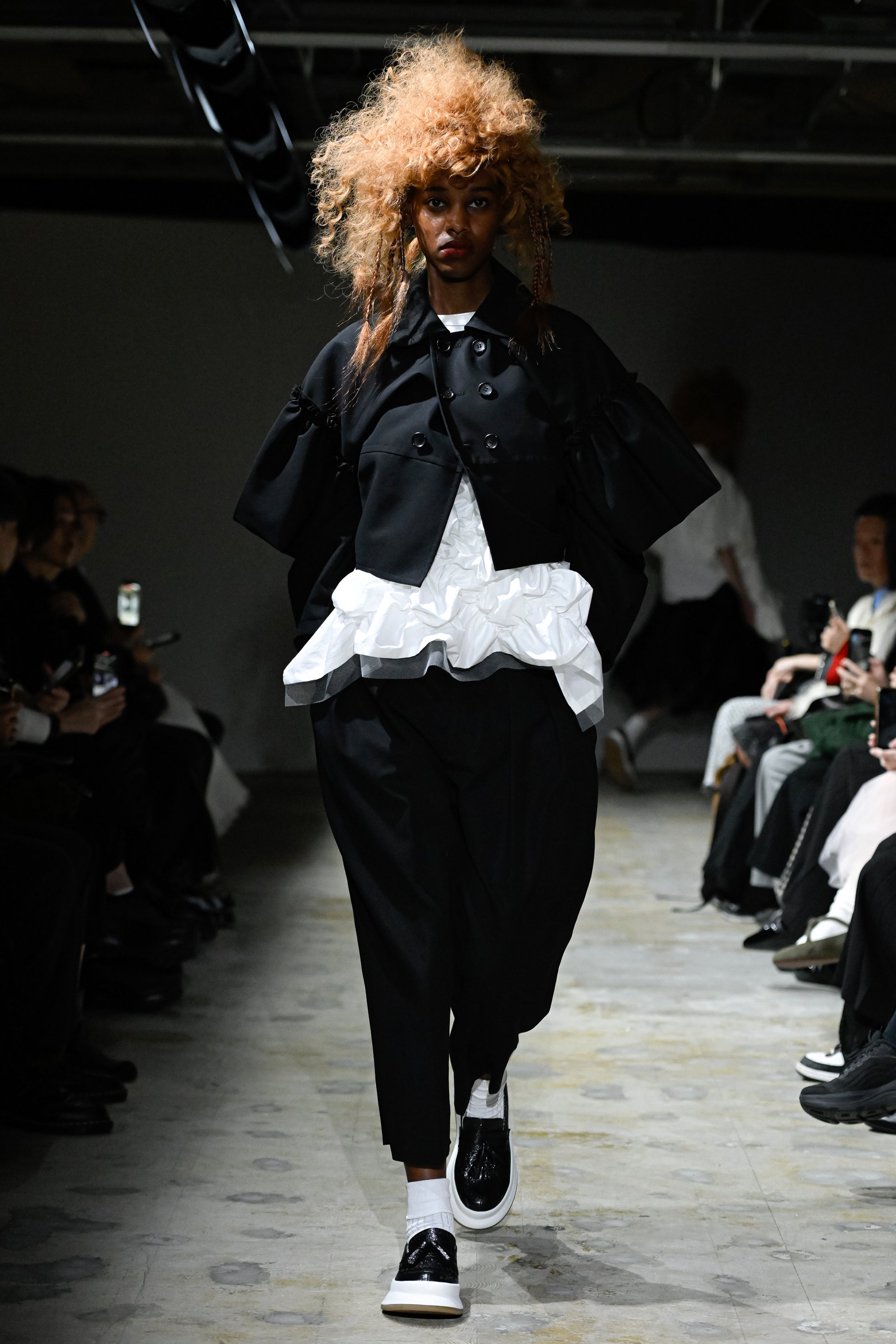 Fashion model wearing a tao SS26 outfit