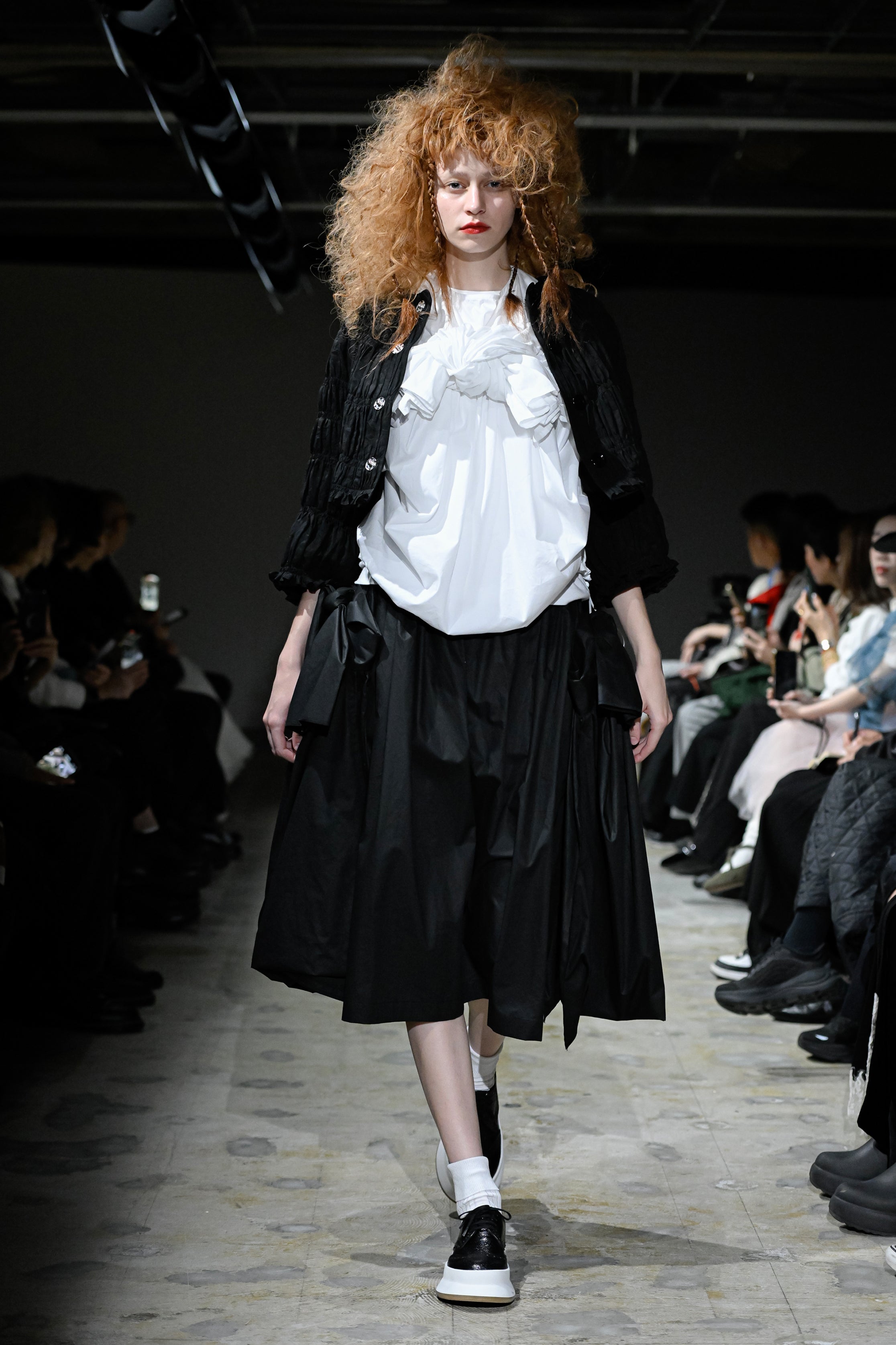 Fashion model wearing a tao SS26 outfit