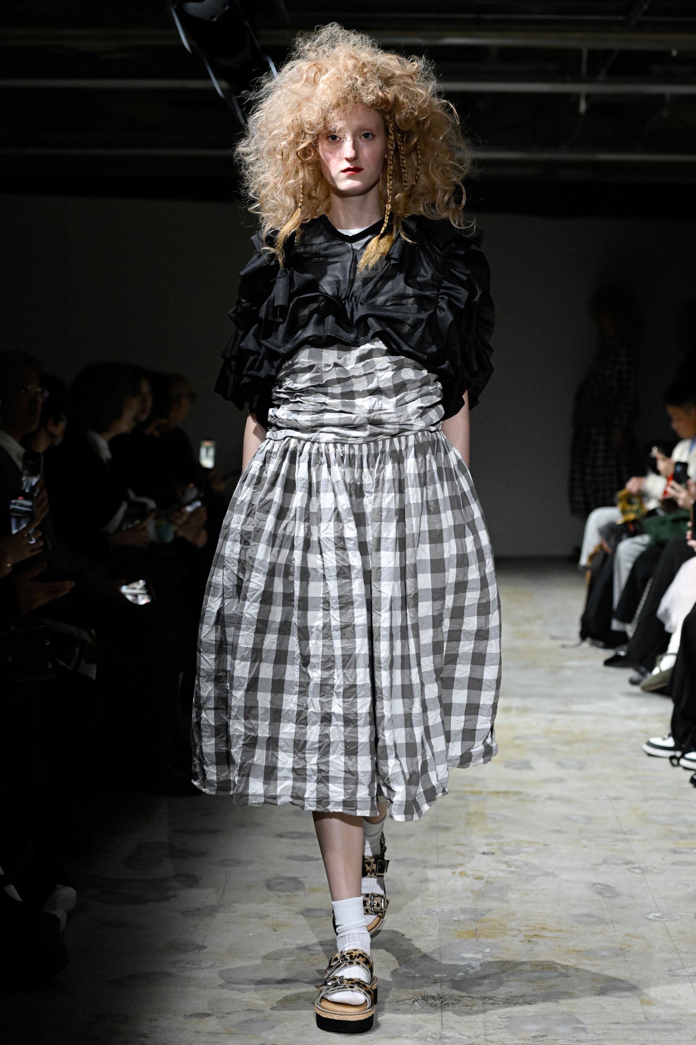 Fashion model wearing a tao SS26 outfit