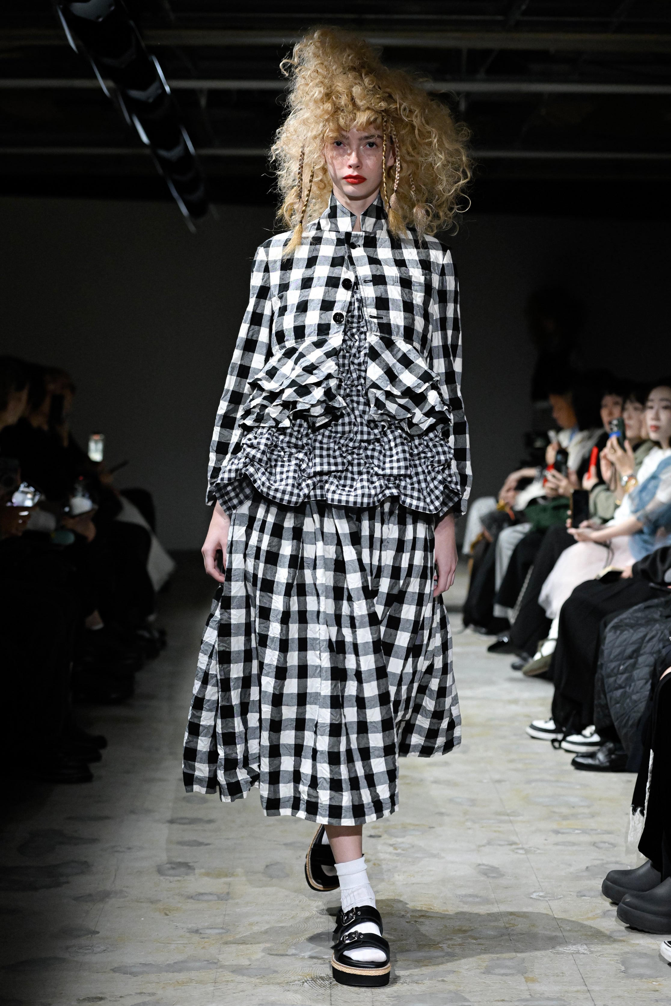 Fashion model wearing a tao SS26 outfit