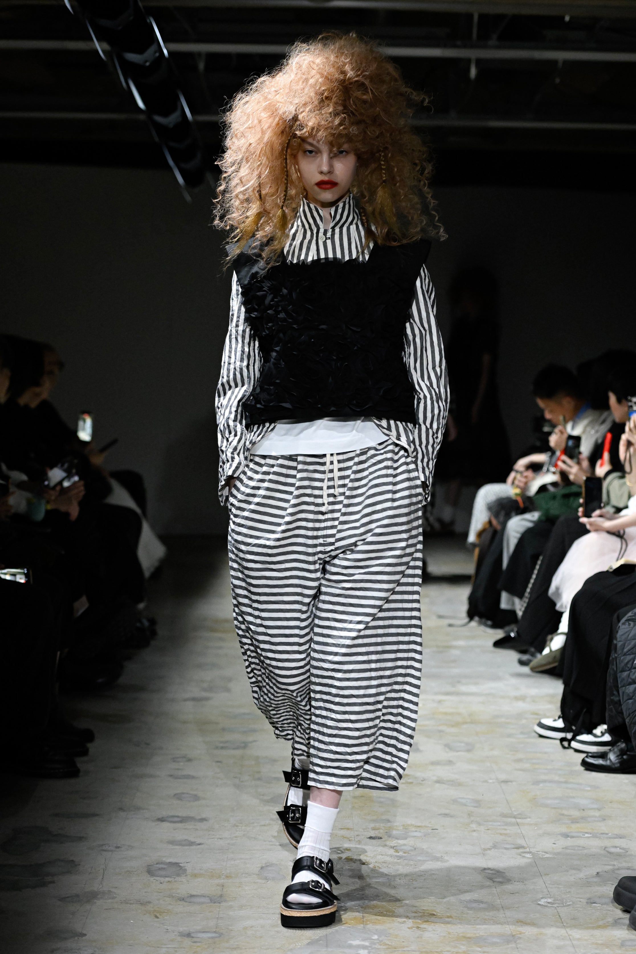 Fashion model wearing a tao SS26 outfit