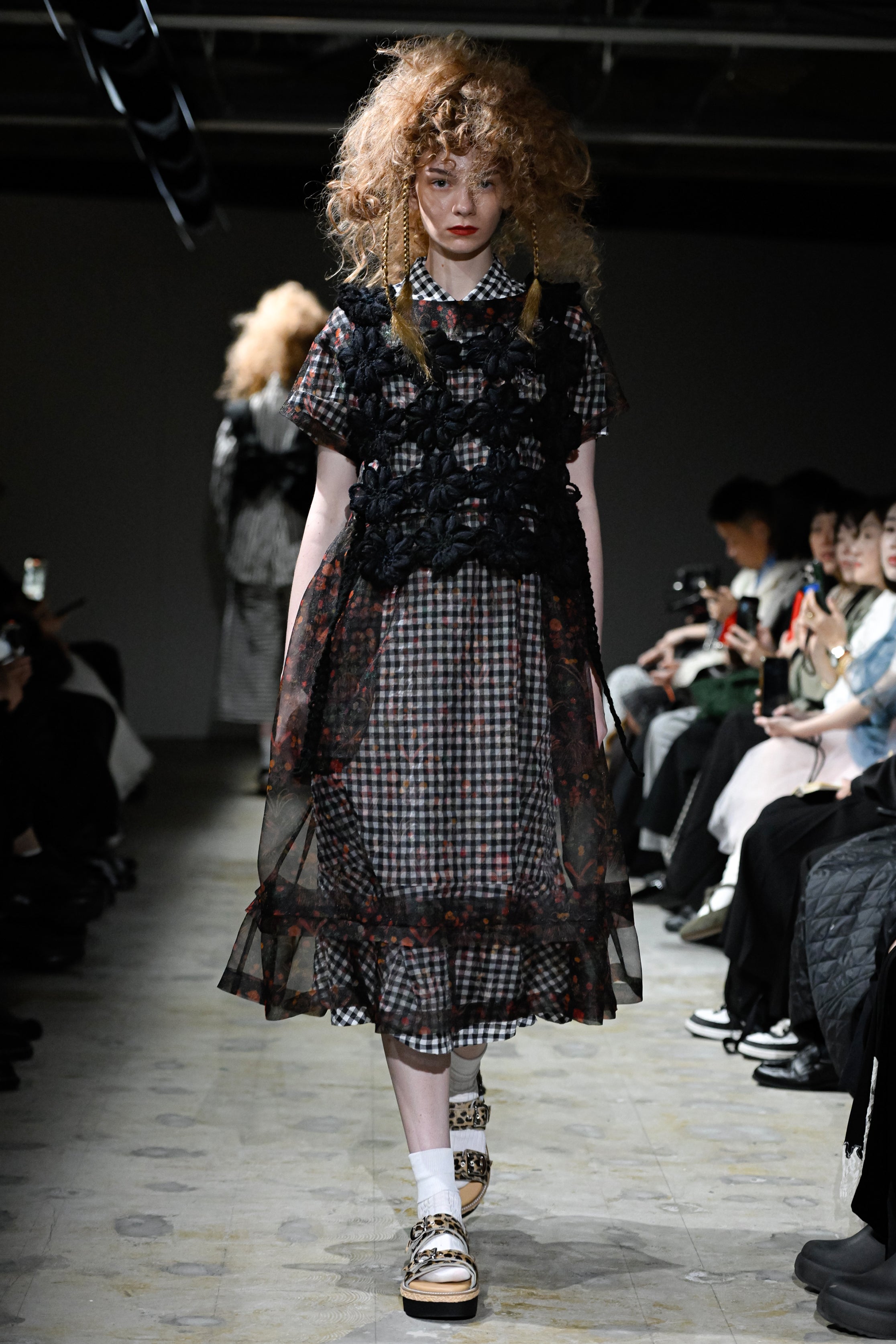 Fashion model wearing a tao SS26 outfit