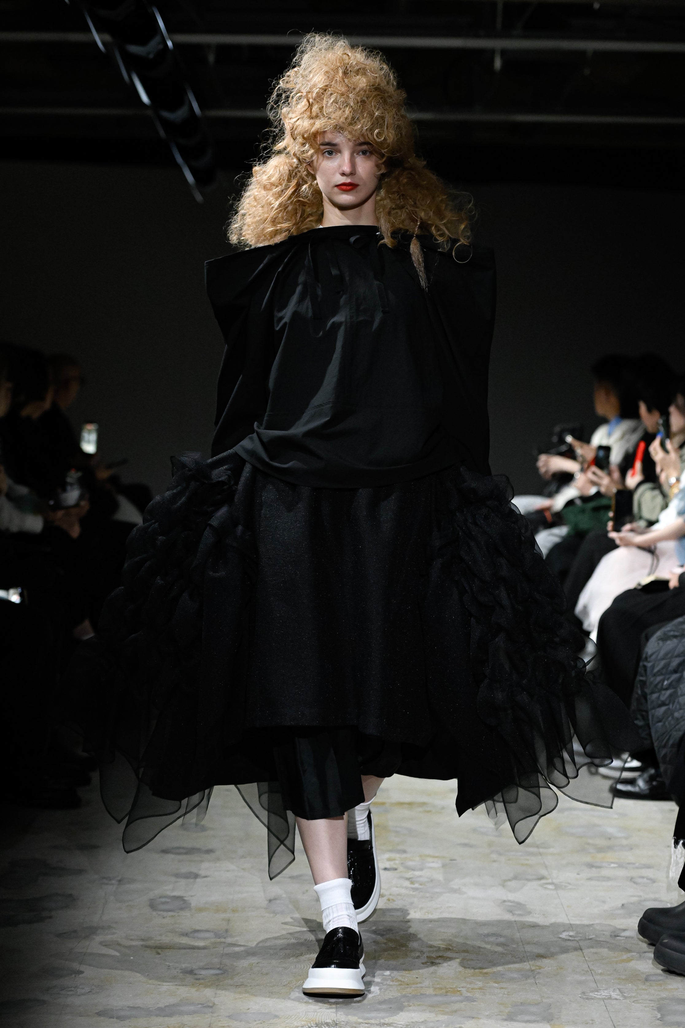 Fashion model wearing a tao SS26 outfit