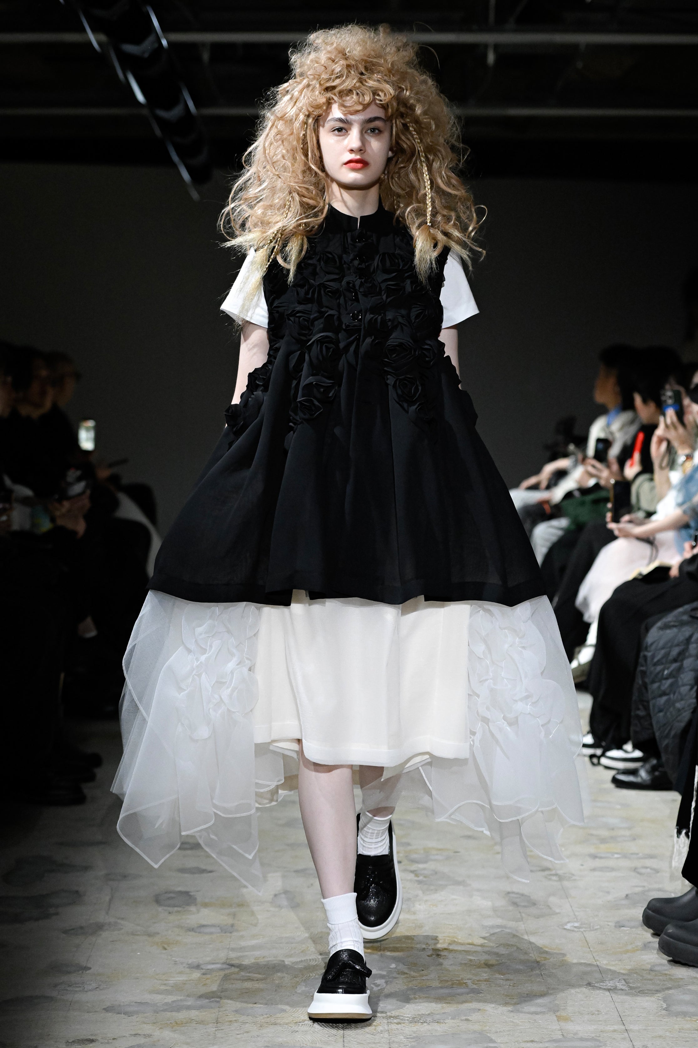 Fashion model wearing a tao SS26 outfit