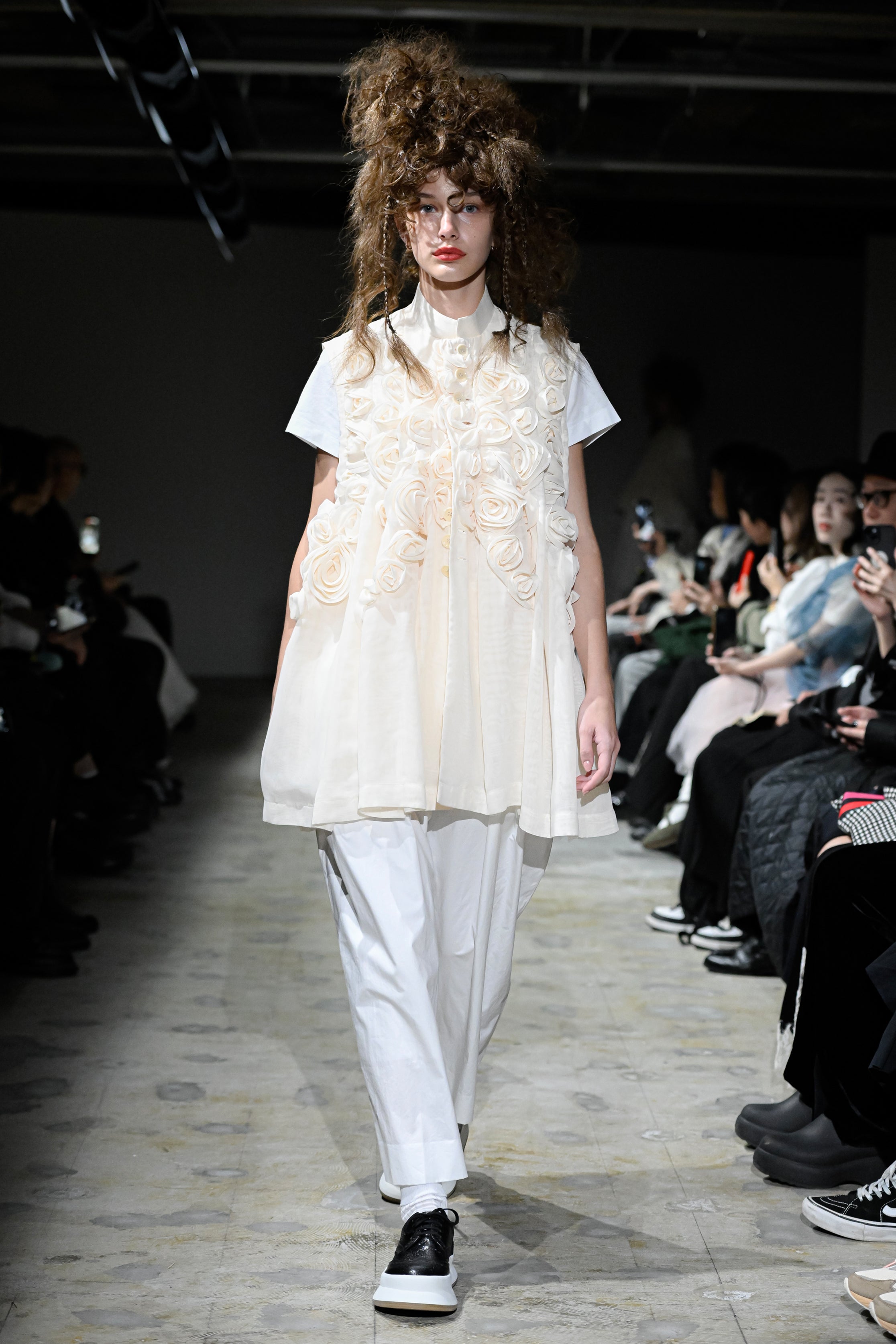 Fashion model wearing a tao SS26 outfit